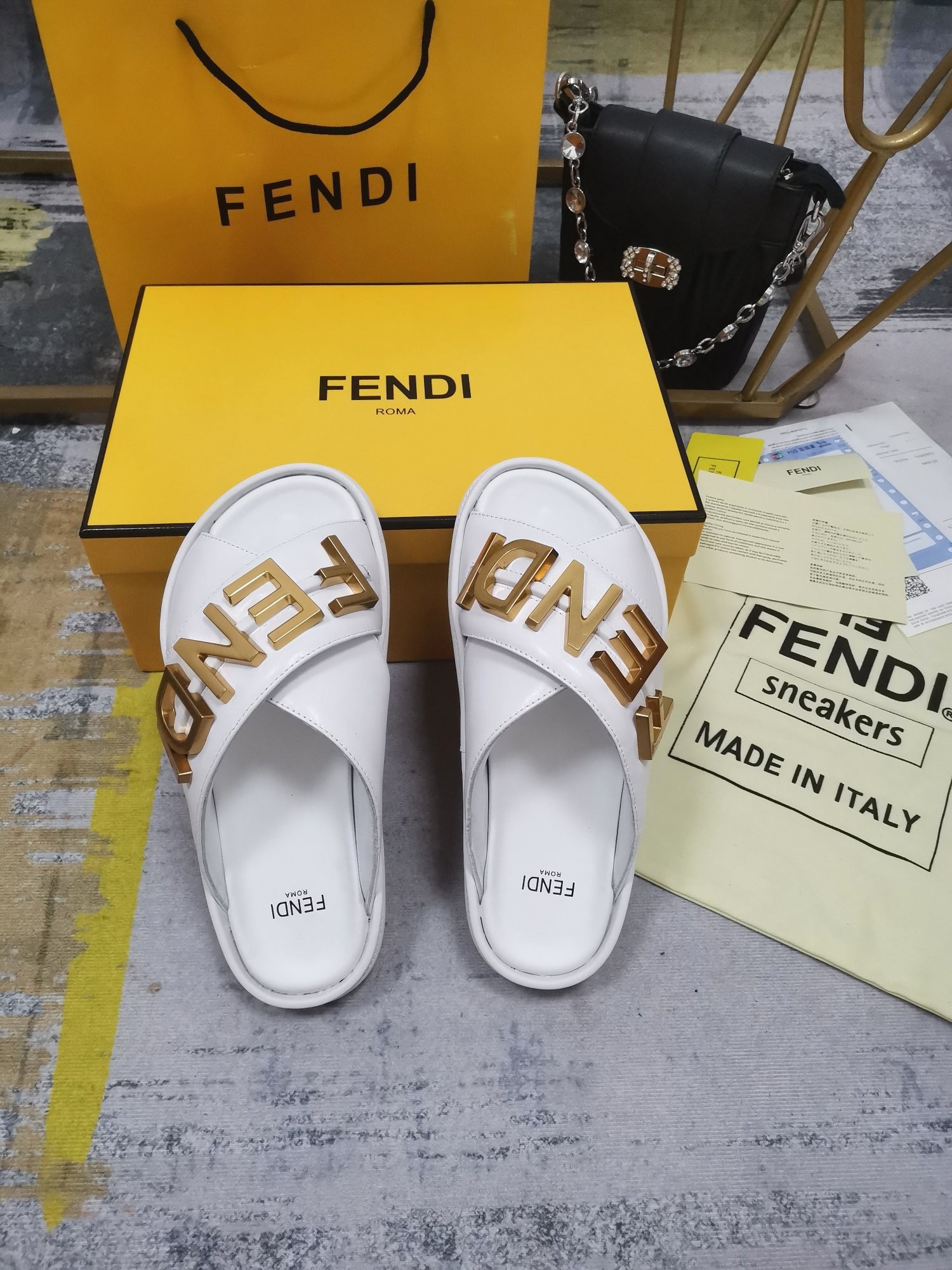 F**di F**digraphy slides in white calfskin