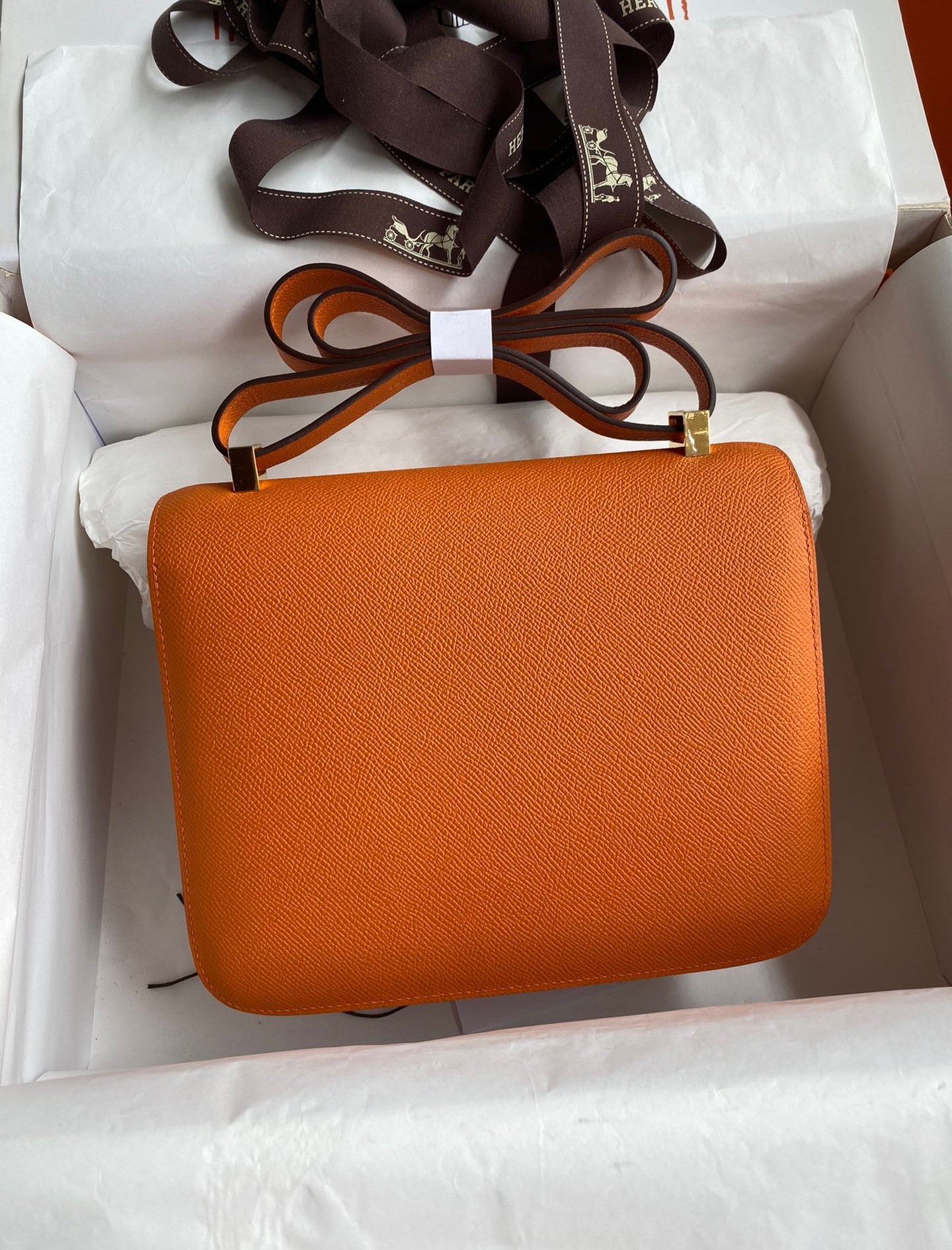 H**mes constance 24 handmade bag in orange epsom calfskin