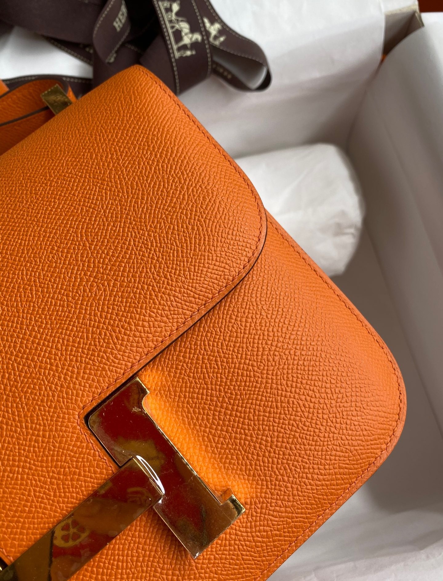 H**mes constance 24 handmade bag in orange epsom calfskin