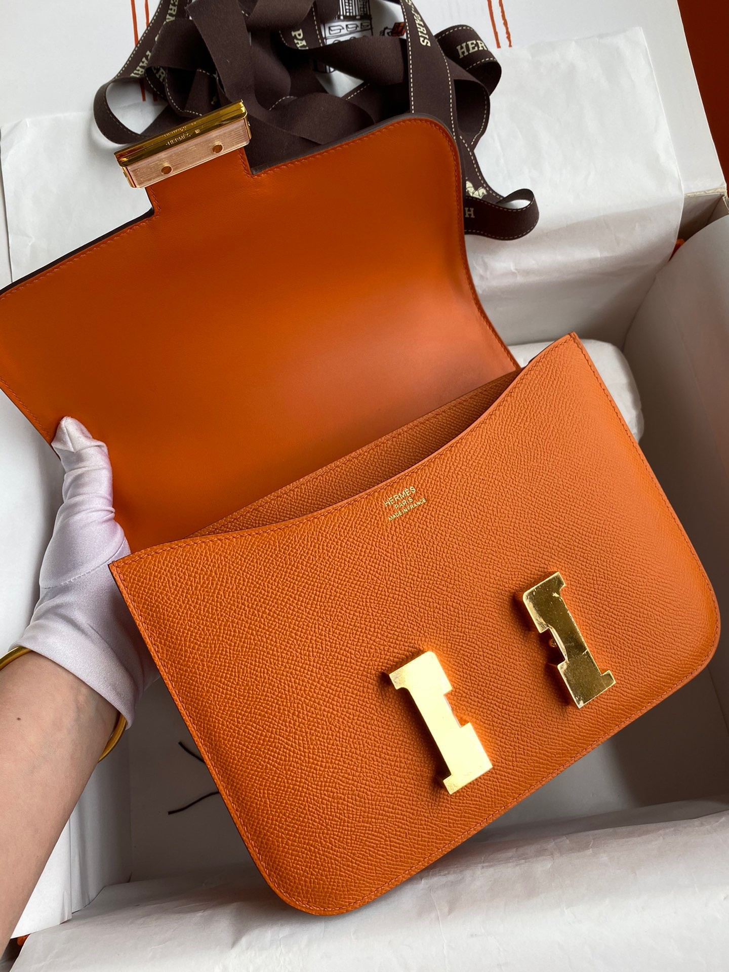H**mes constance 24 handmade bag in orange epsom calfskin