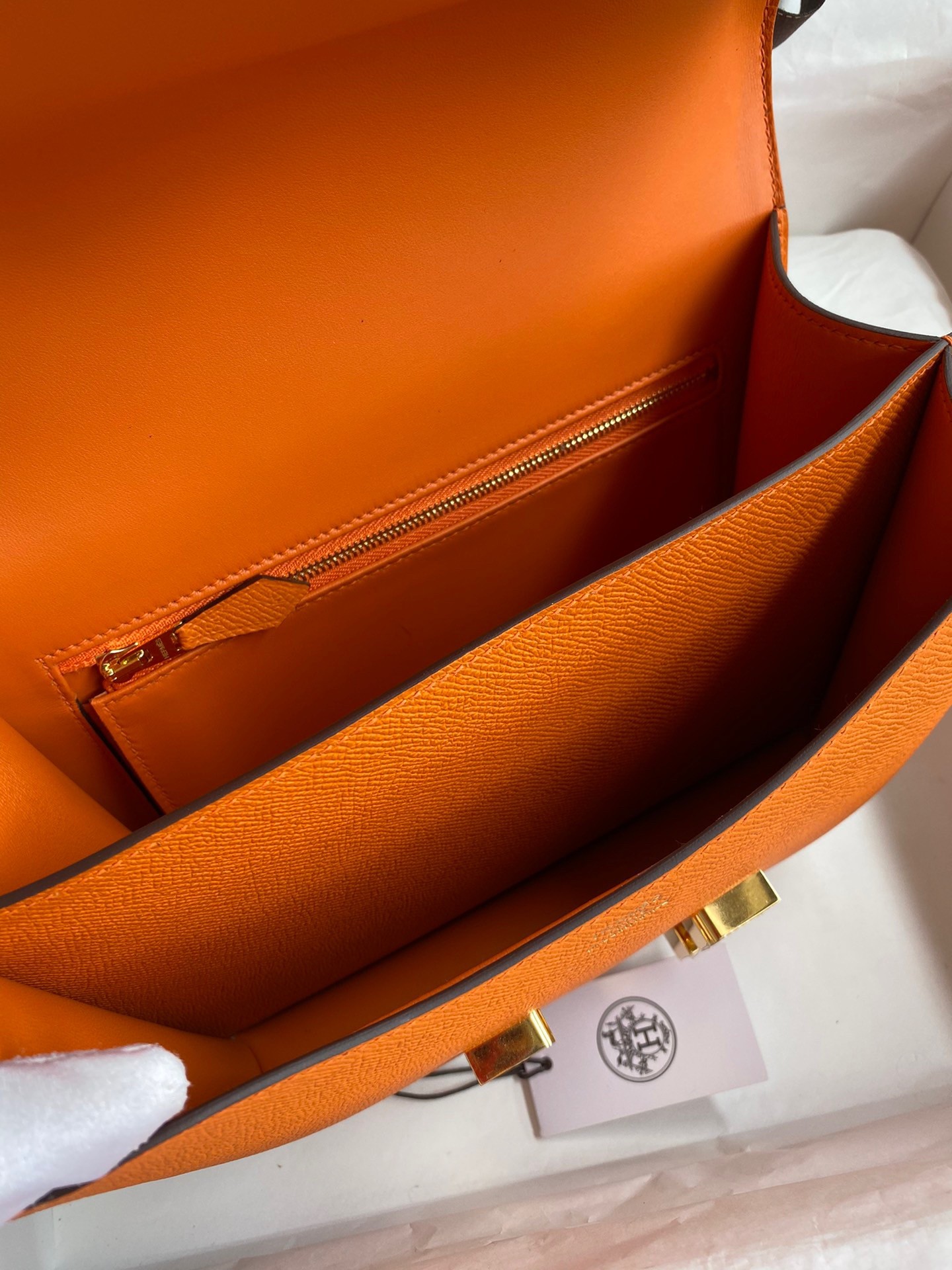 H**mes constance 24 handmade bag in orange epsom calfskin