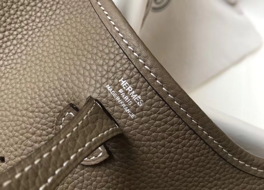 H**mes evelyne iii tpm mini bag in taupe clemence leather
