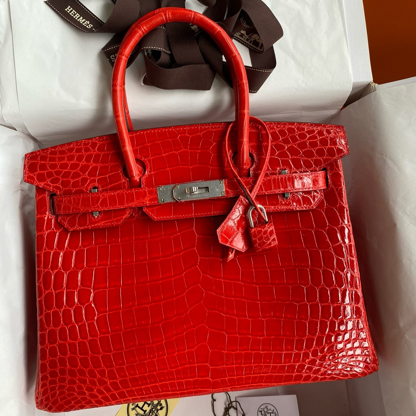 H**mes birkin 25 handmade bag in red crocodile niloticus shiny skin