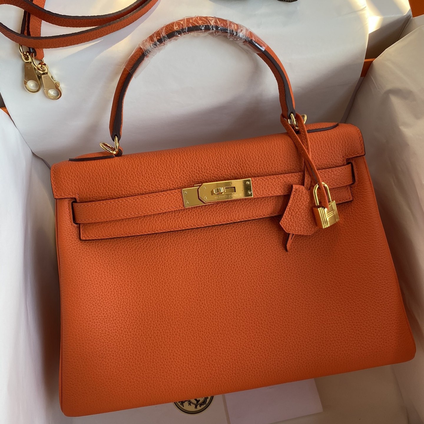 H**mes kelly retourne 32 handmade bag in orange clemence leather