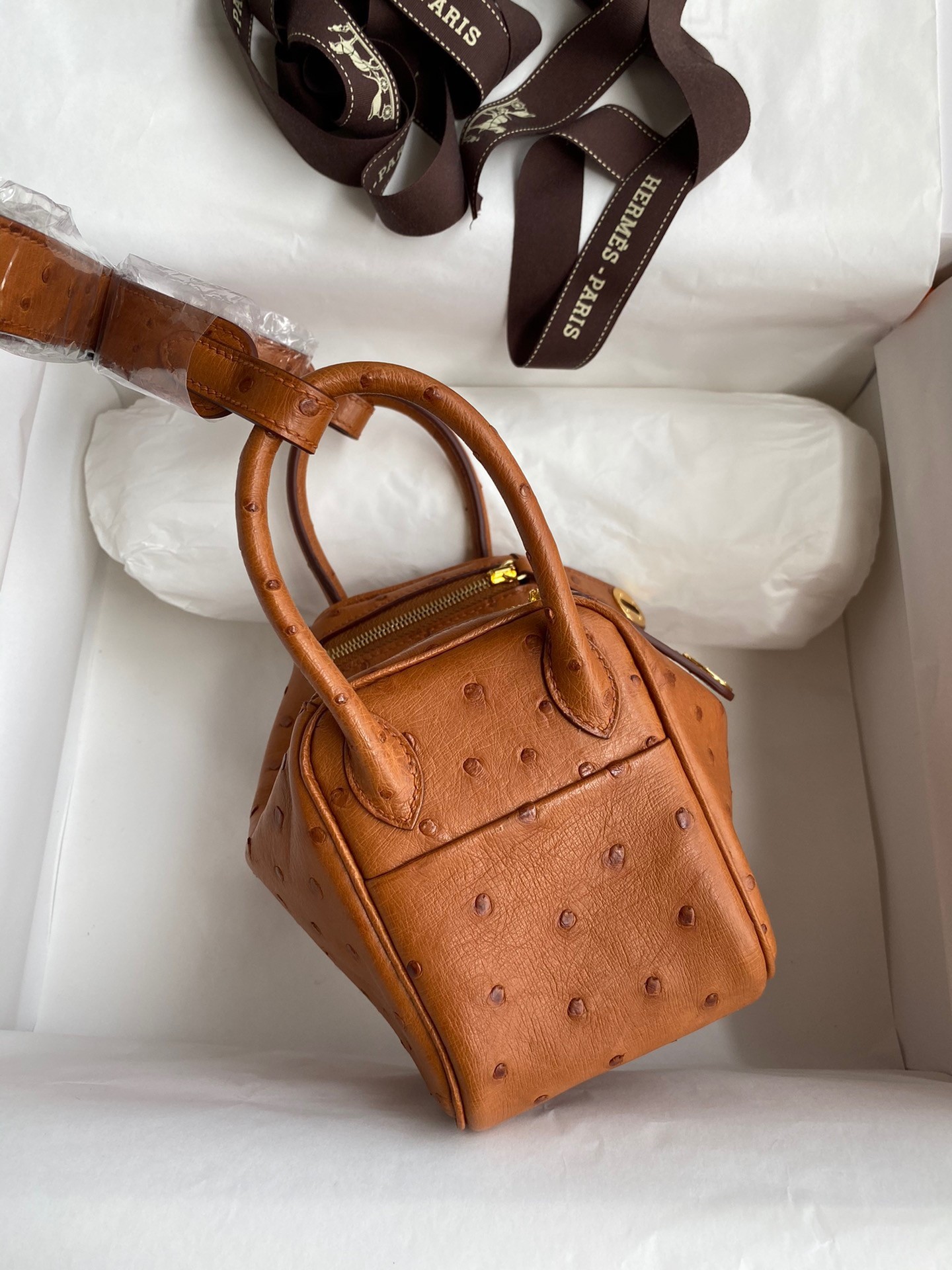 H**mes mini lindy handmade bag in gold ostrich leather