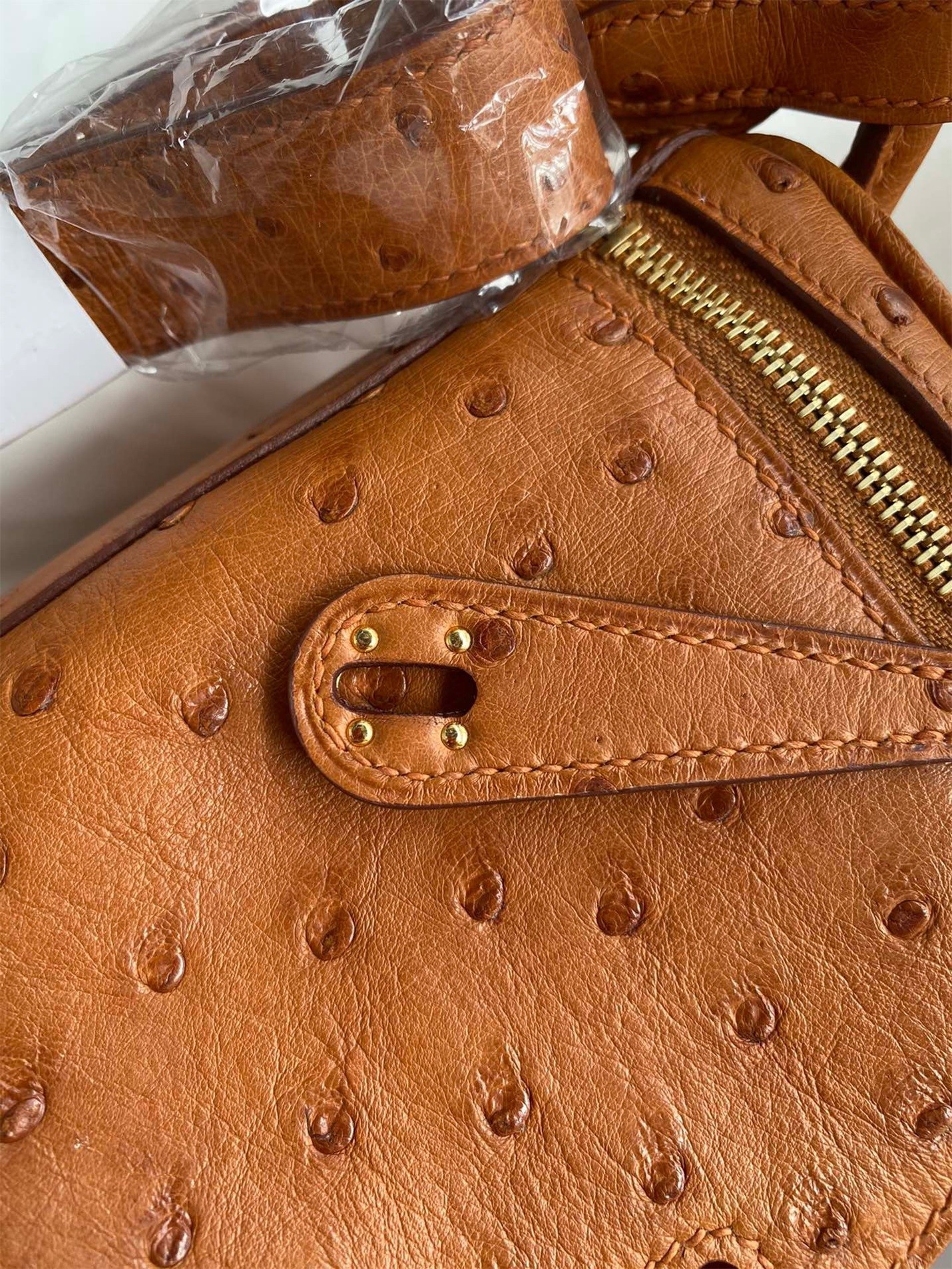 H**mes mini lindy handmade bag in gold ostrich leather