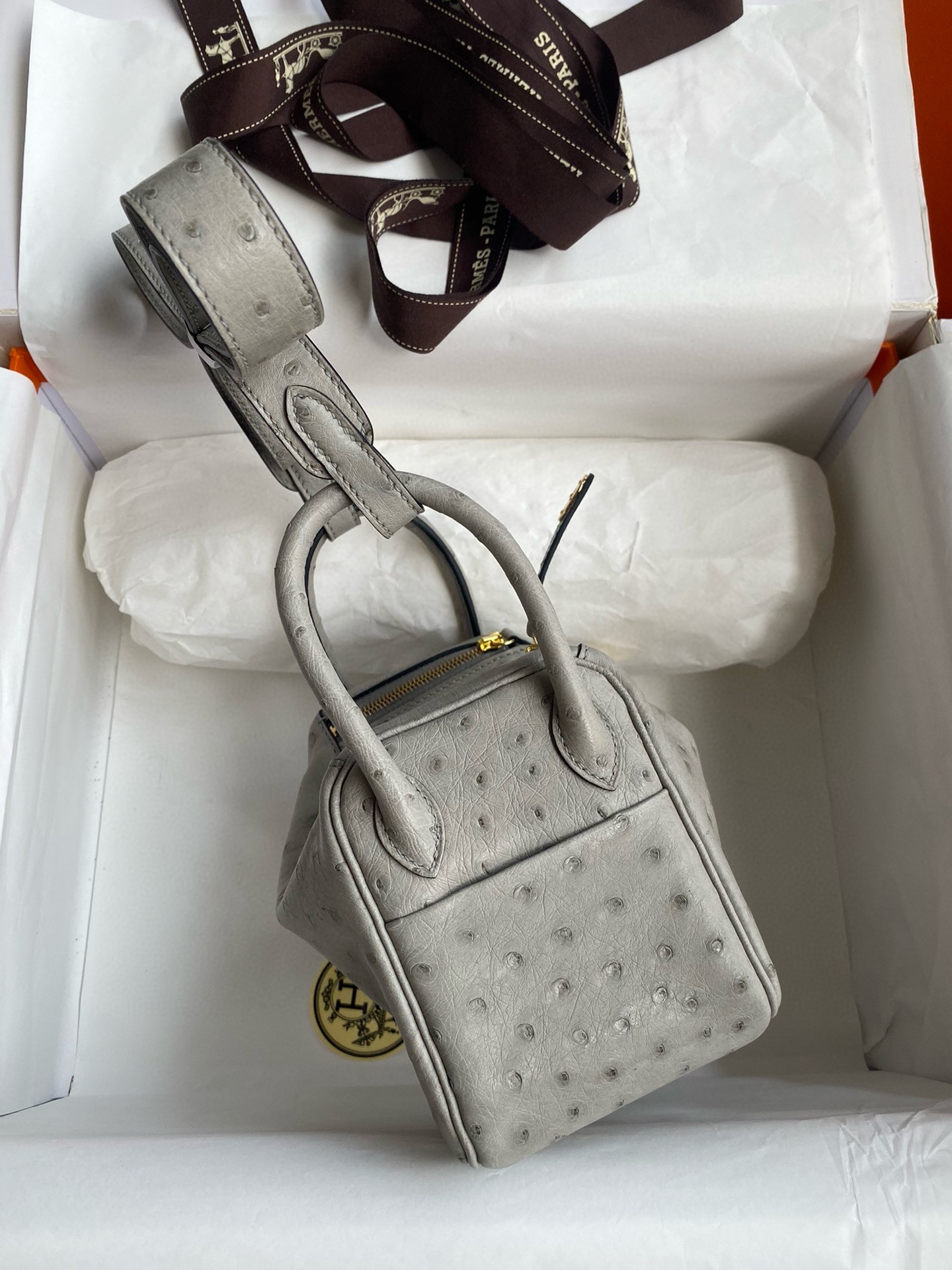 H**mes mini lindy handmade bag in pearl grey ostrich leather