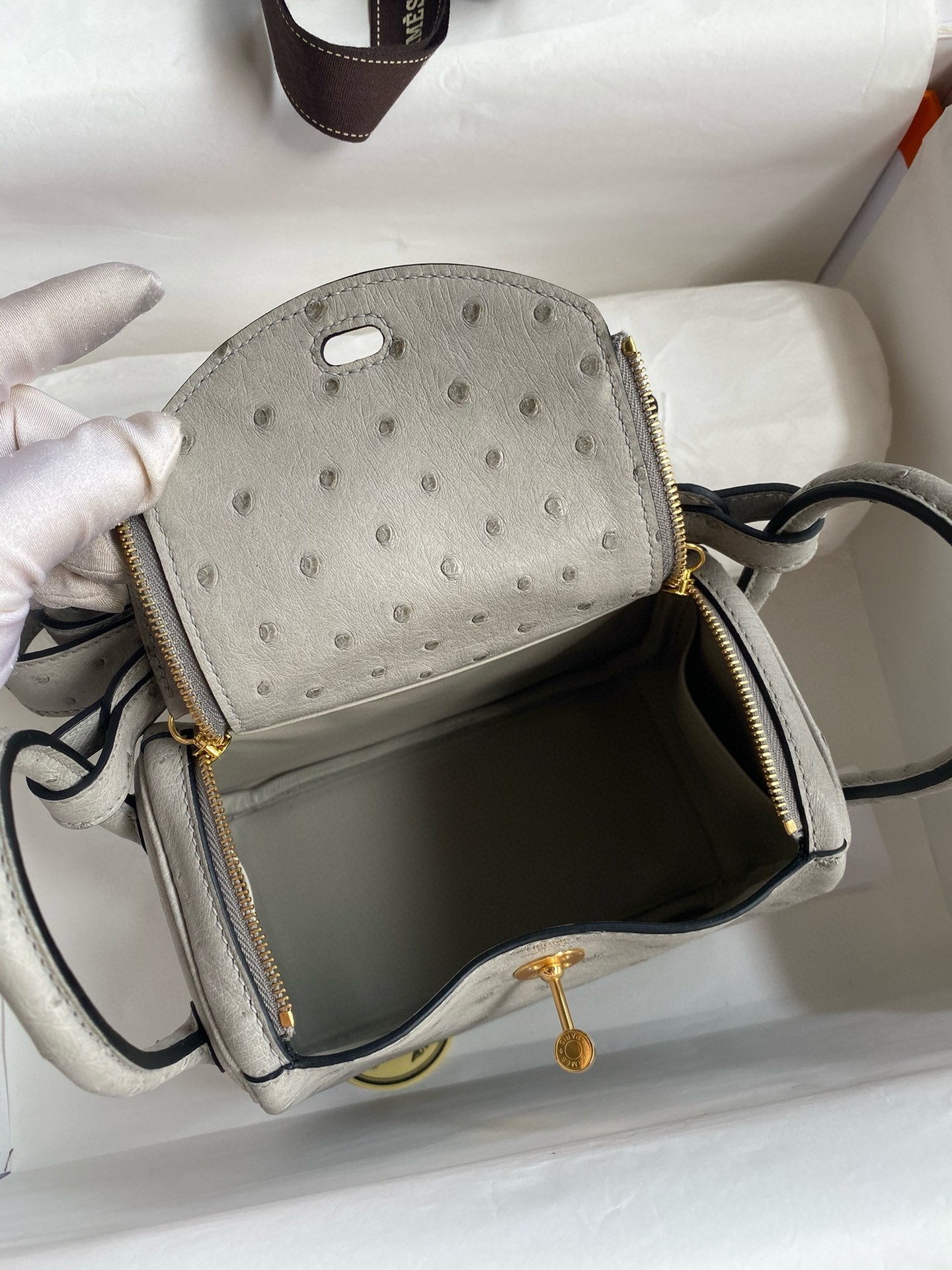 H**mes mini lindy handmade bag in pearl grey ostrich leather