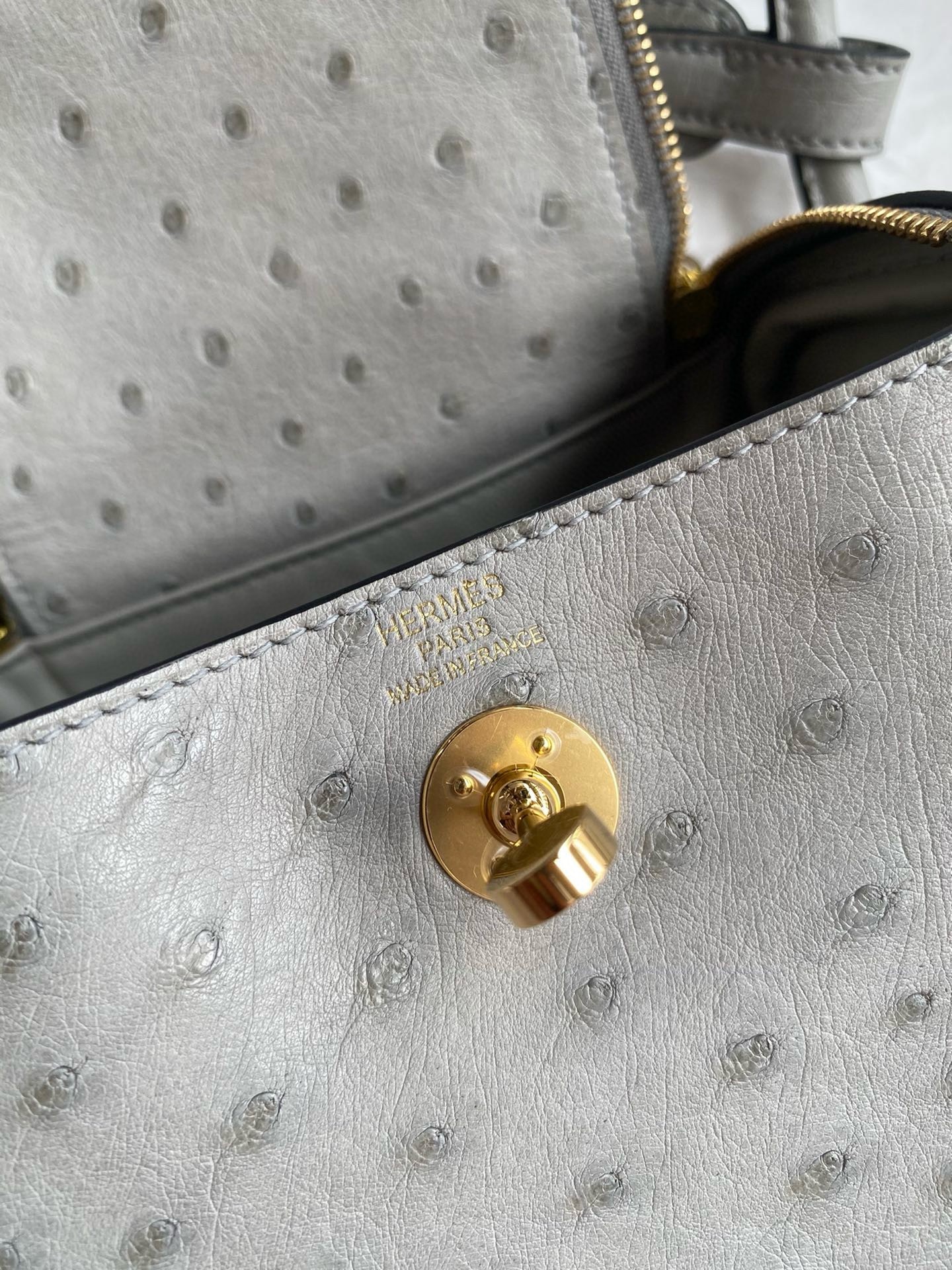H**mes mini lindy handmade bag in pearl grey ostrich leather