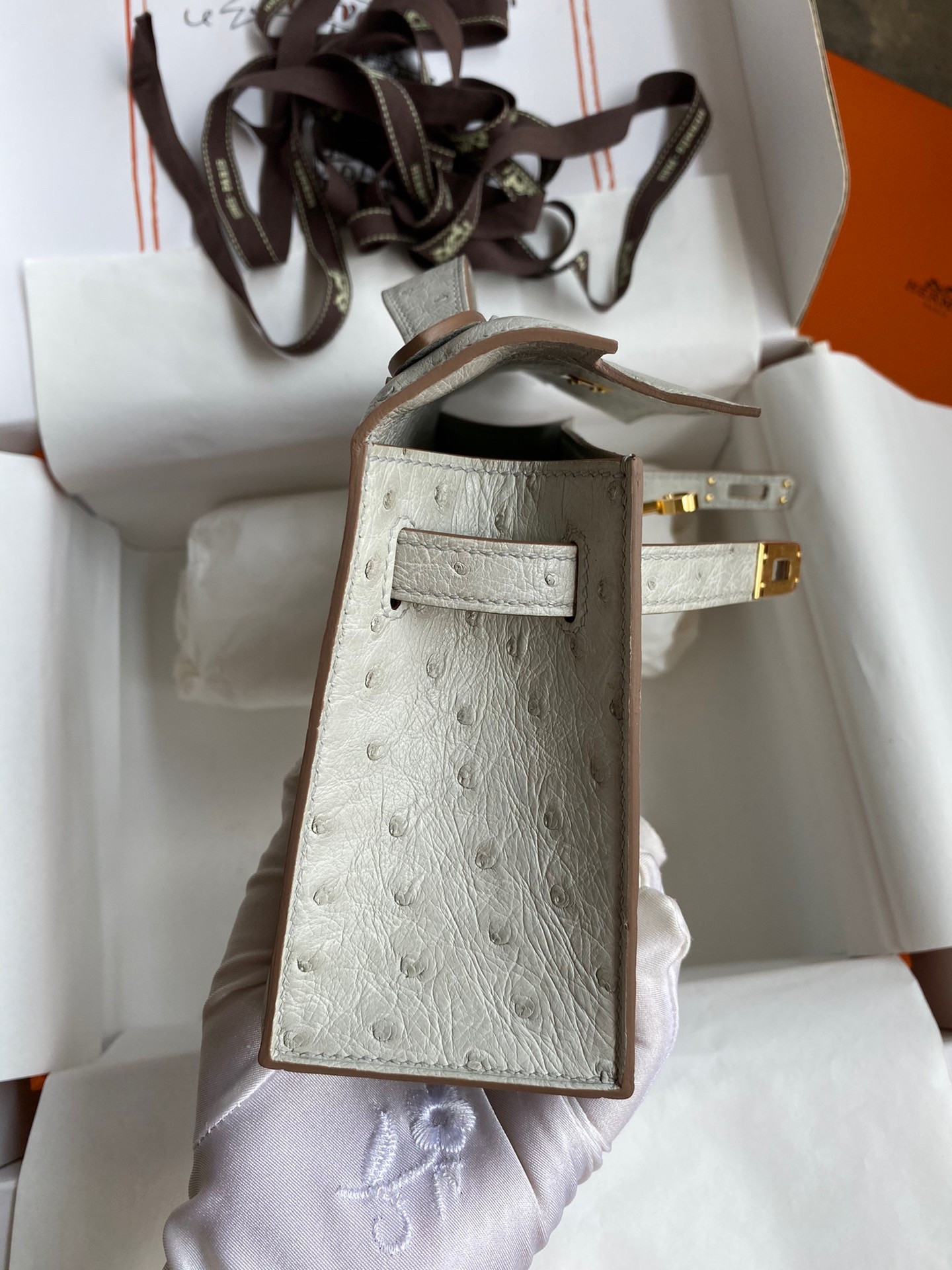 H**mes kelly pochette handmade bag in pearl grey ostrich leather