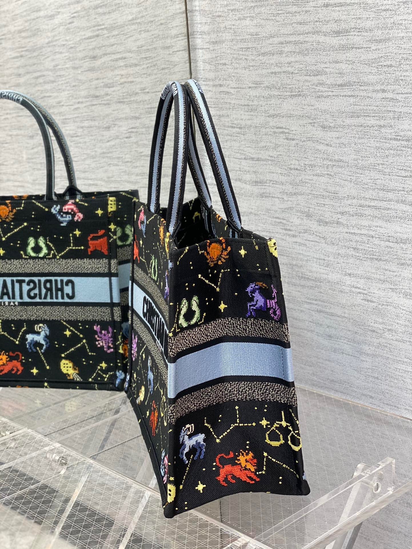 D*or medium book tote bag in black pixel zodiac embroidery