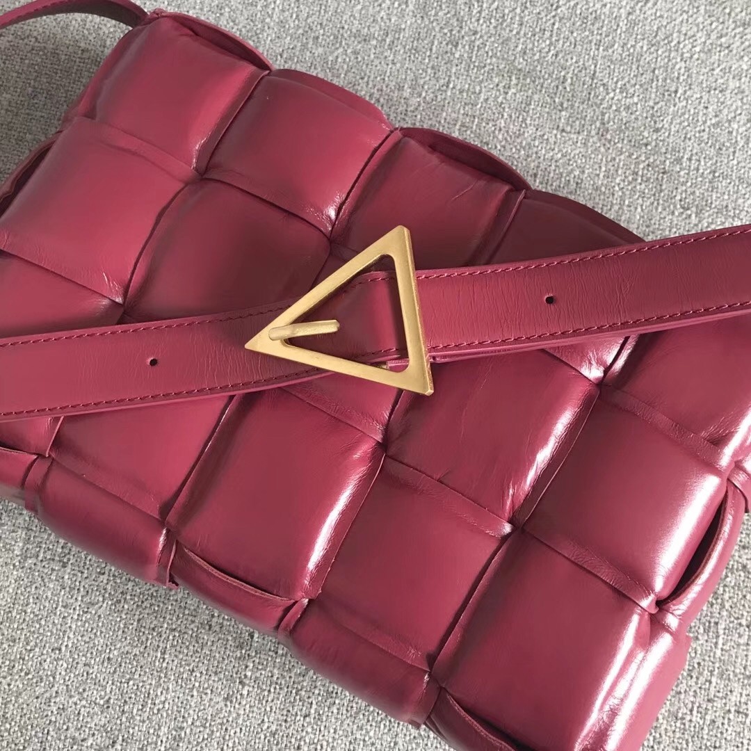 bo*te*ga Ve*ne*ta padded cassette bag in amaranto calfskin