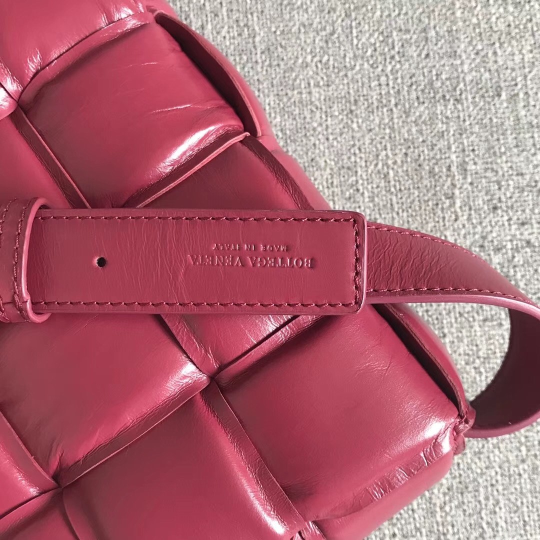 bo*te*ga Ve*ne*ta padded cassette bag in amaranto calfskin