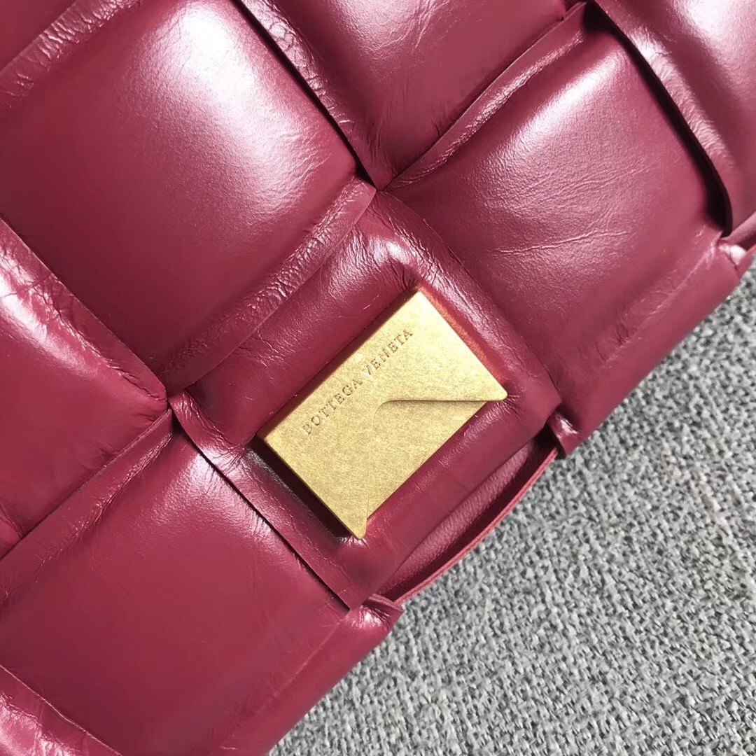 bo*te*ga Ve*ne*ta padded cassette bag in amaranto calfskin