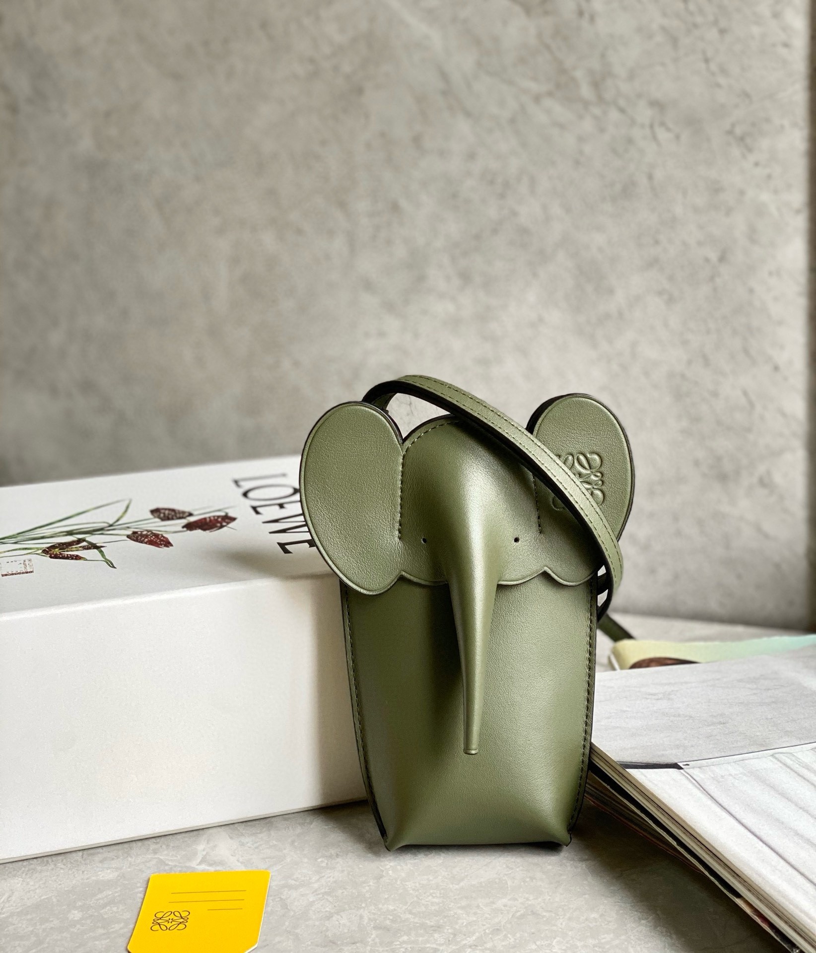 L0ew* elephant pocket in green calfskin