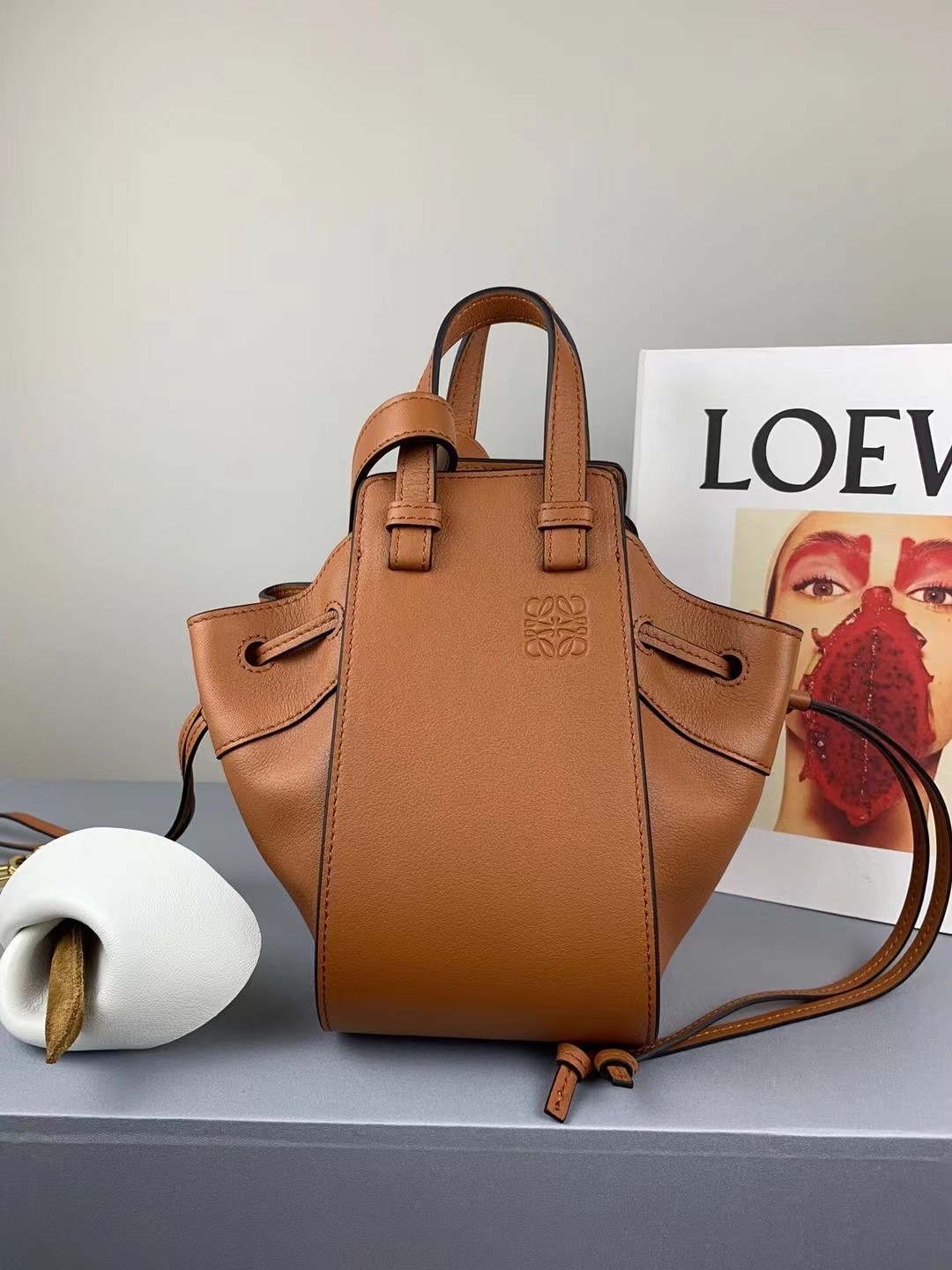 L0ew* mini hammock drawstring bag in brown calfskin