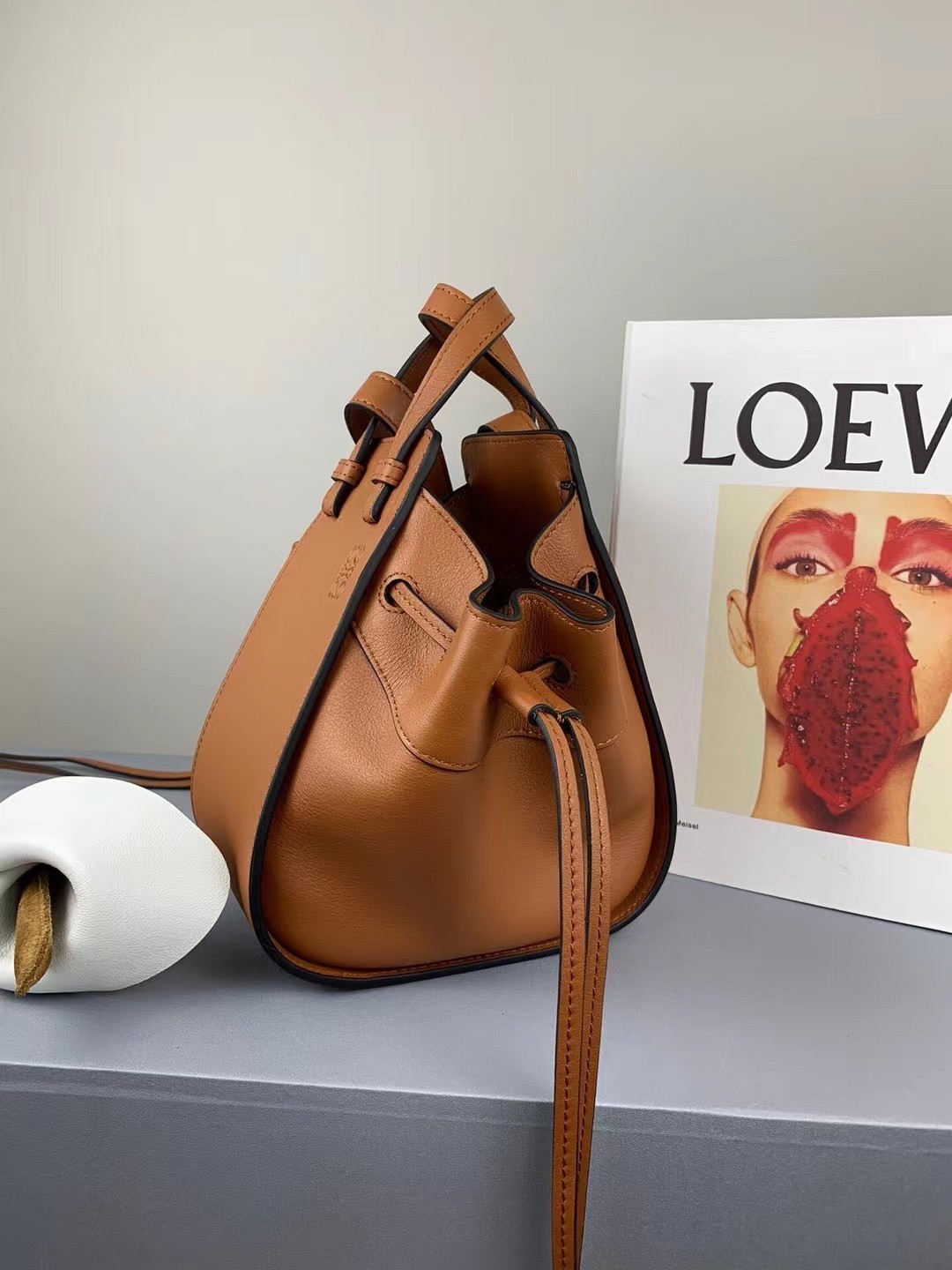 L0ew* mini hammock drawstring bag in brown calfskin