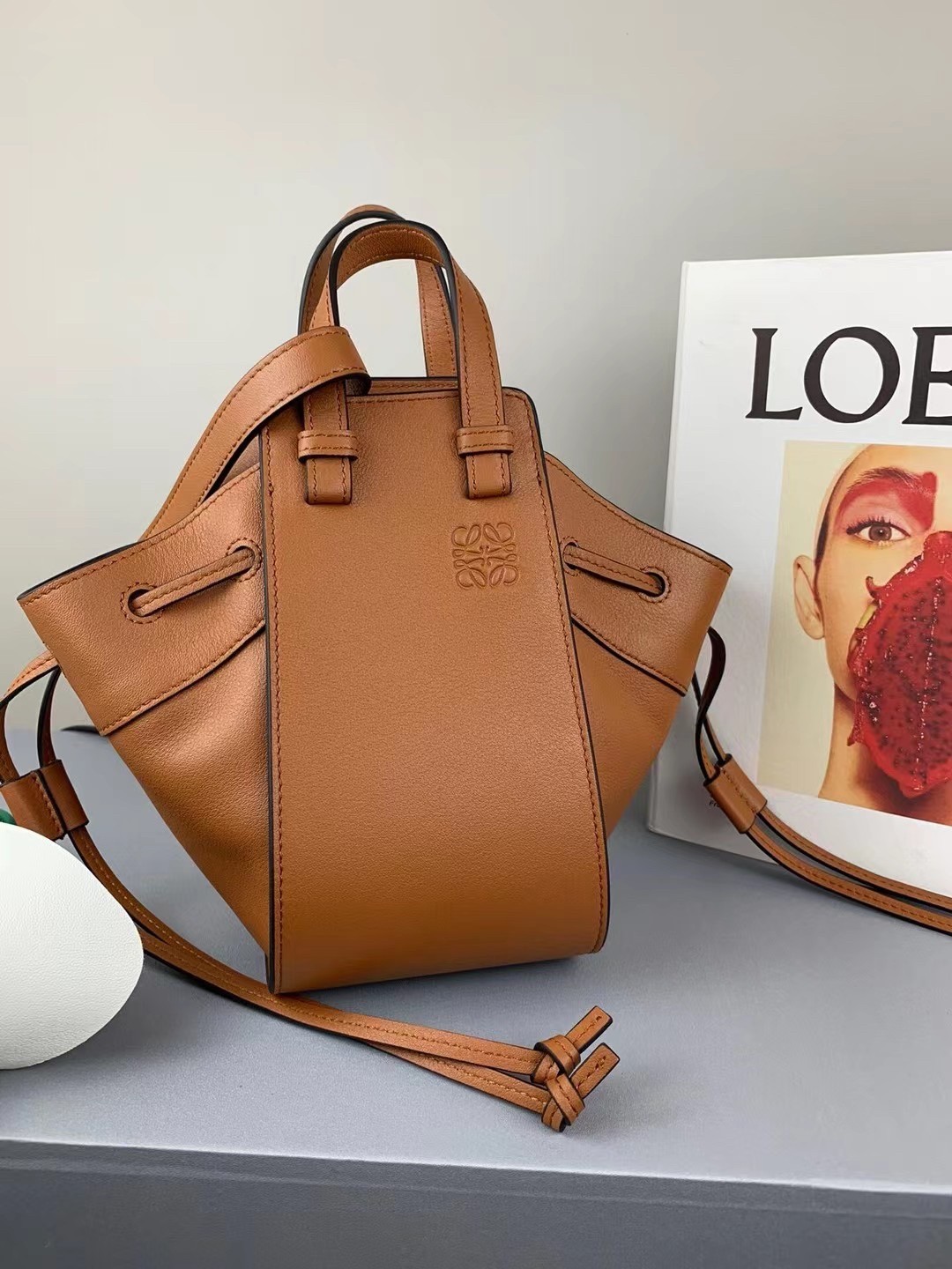 L0ew* mini hammock drawstring bag in brown calfskin