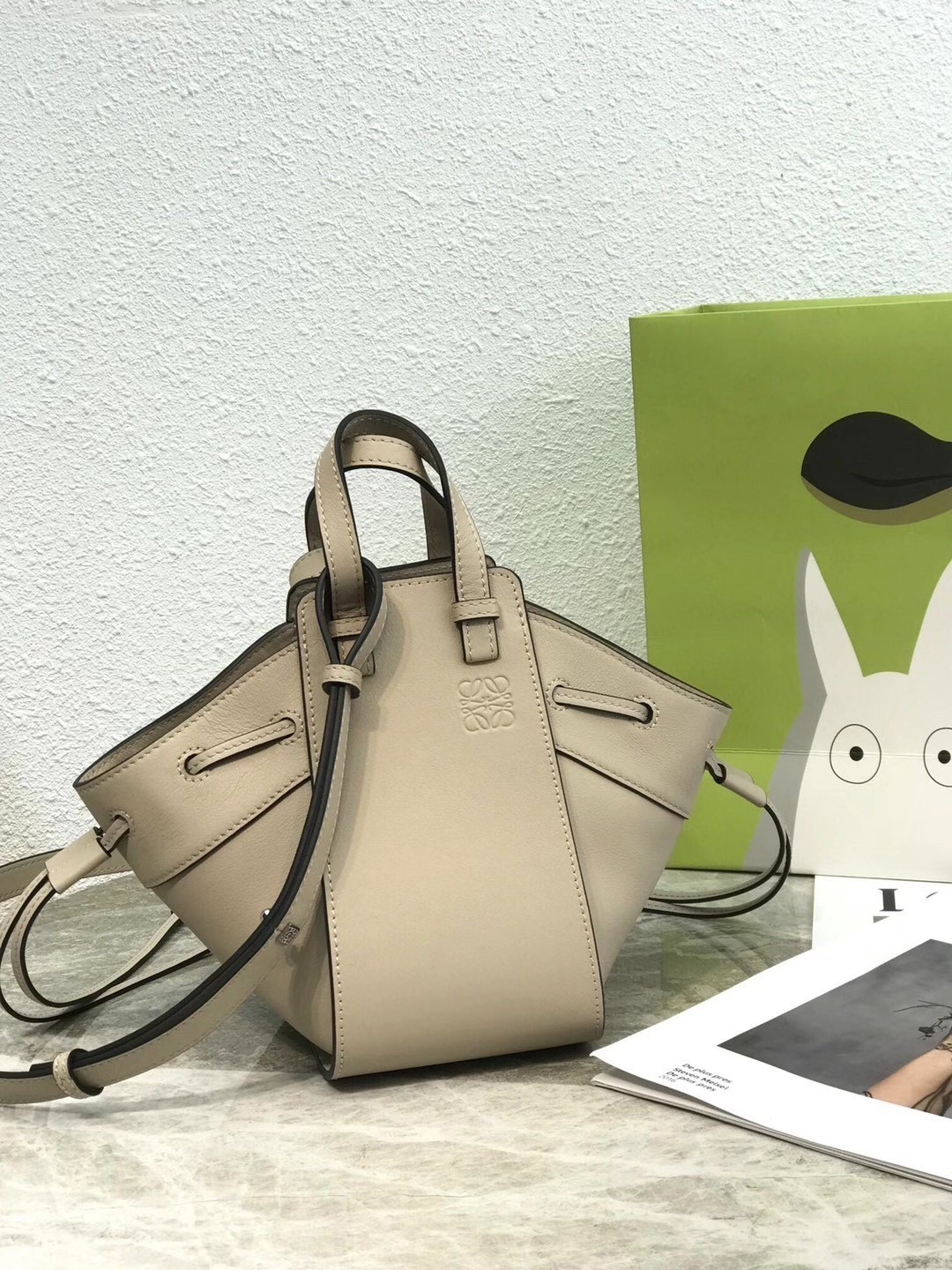 L0ew* mini hammock drawstring bag in sand calfskin