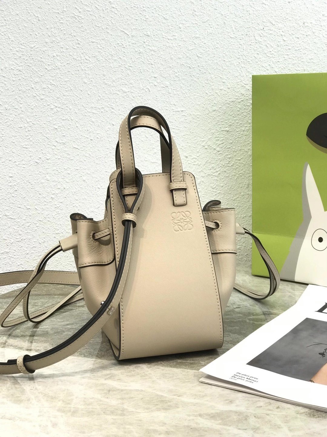 L0ew* mini hammock drawstring bag in sand calfskin