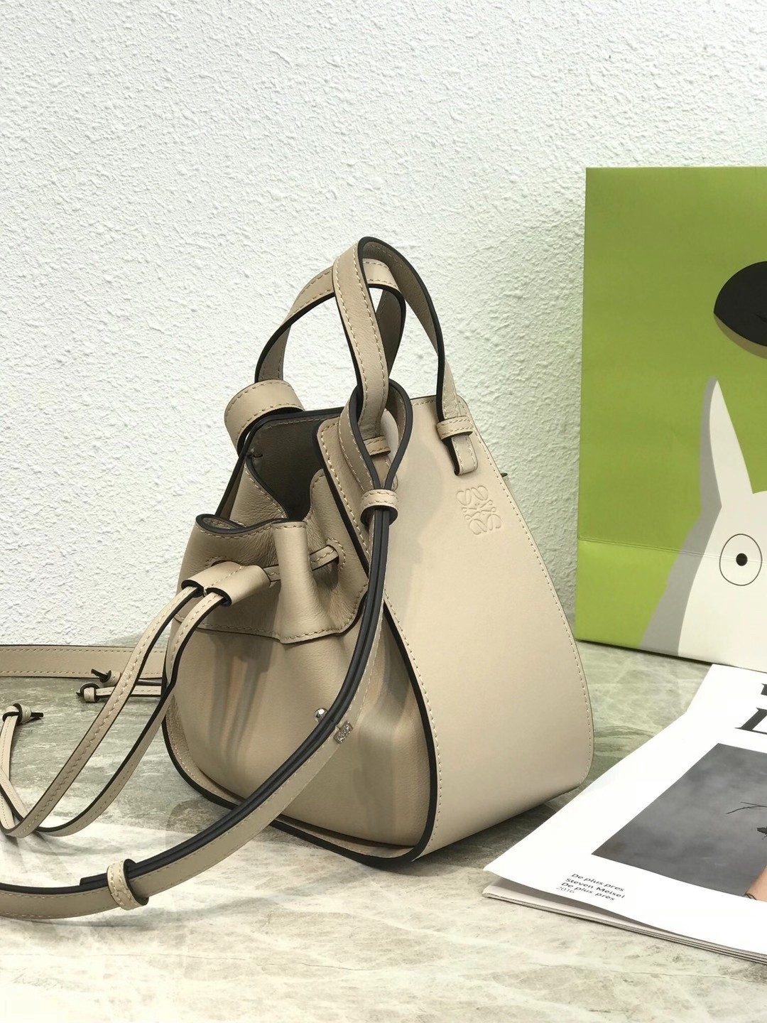 L0ew* mini hammock drawstring bag in sand calfskin
