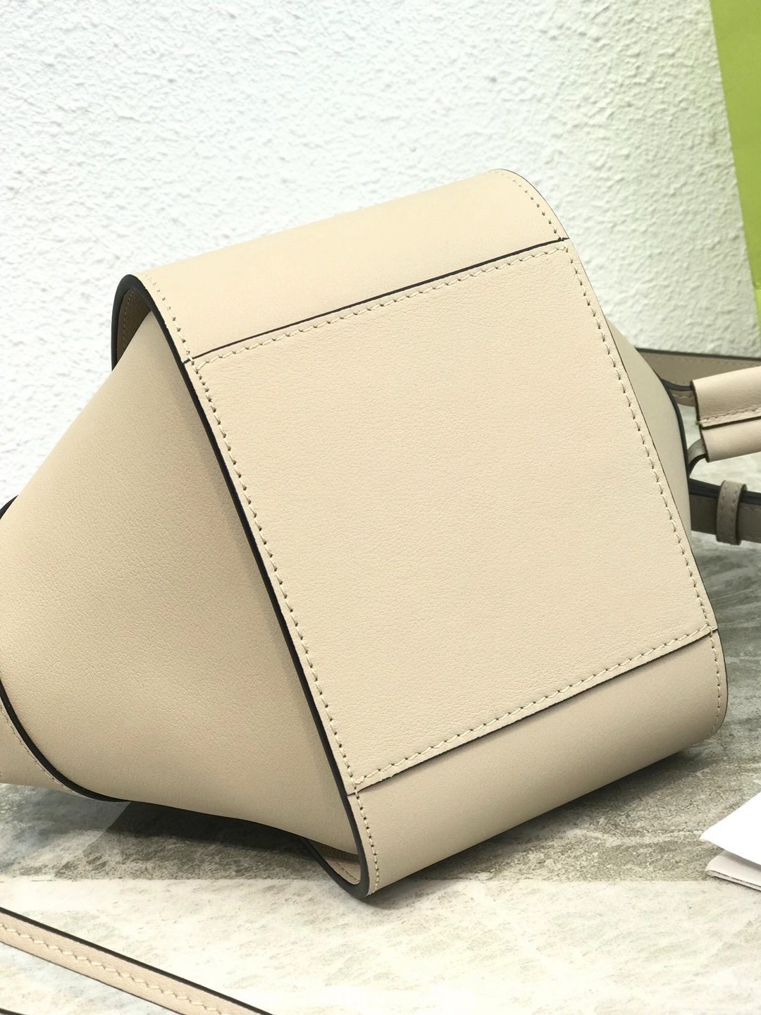 L0ew* mini hammock drawstring bag in sand calfskin