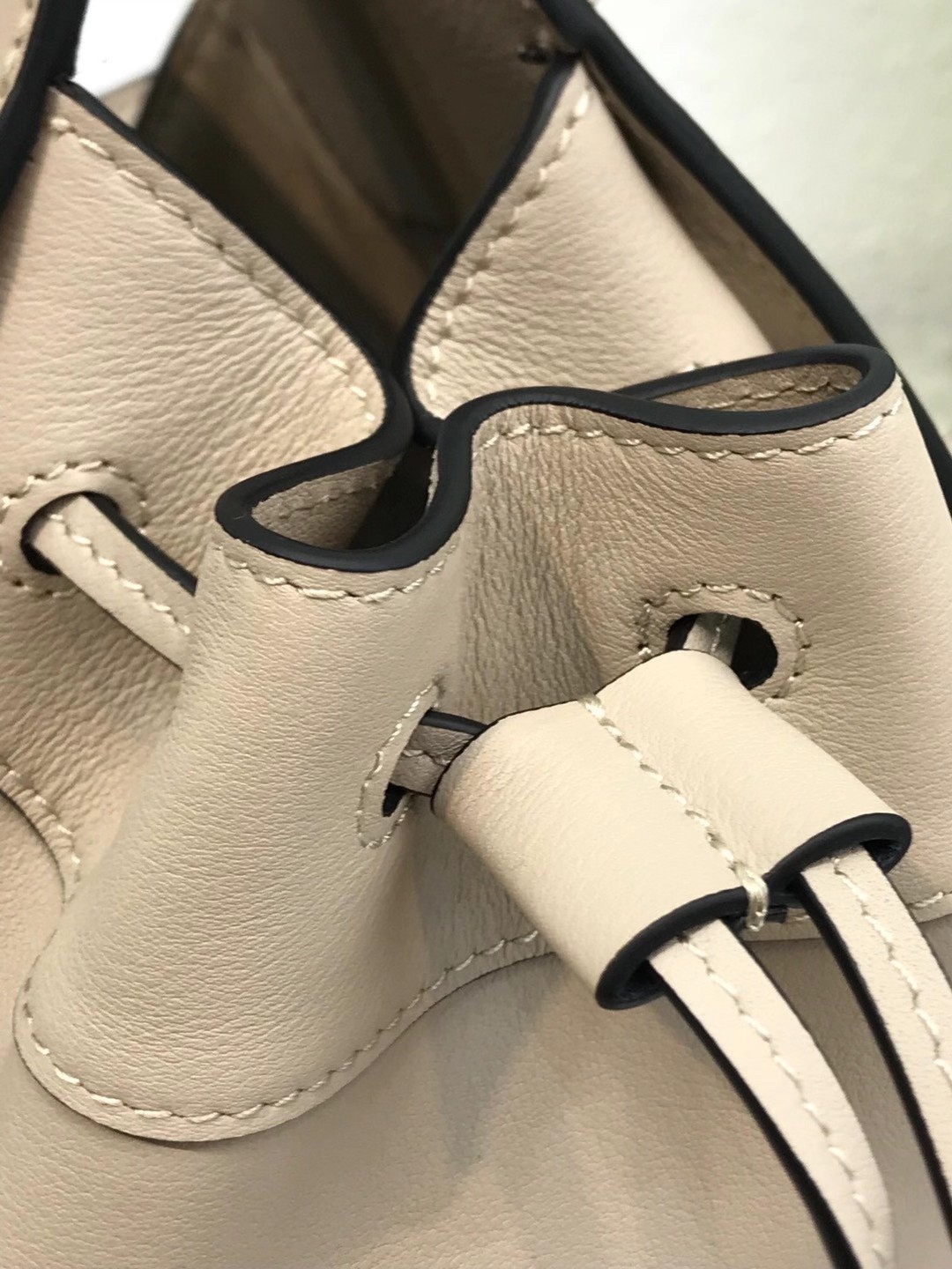 L0ew* mini hammock drawstring bag in sand calfskin