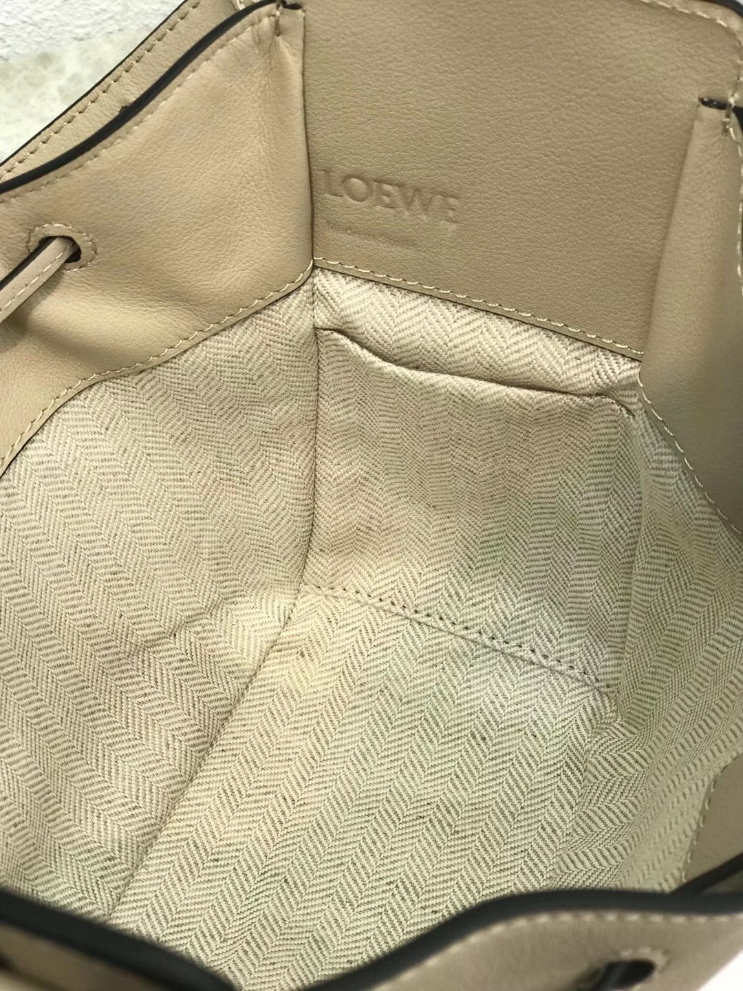 L0ew* mini hammock drawstring bag in sand calfskin