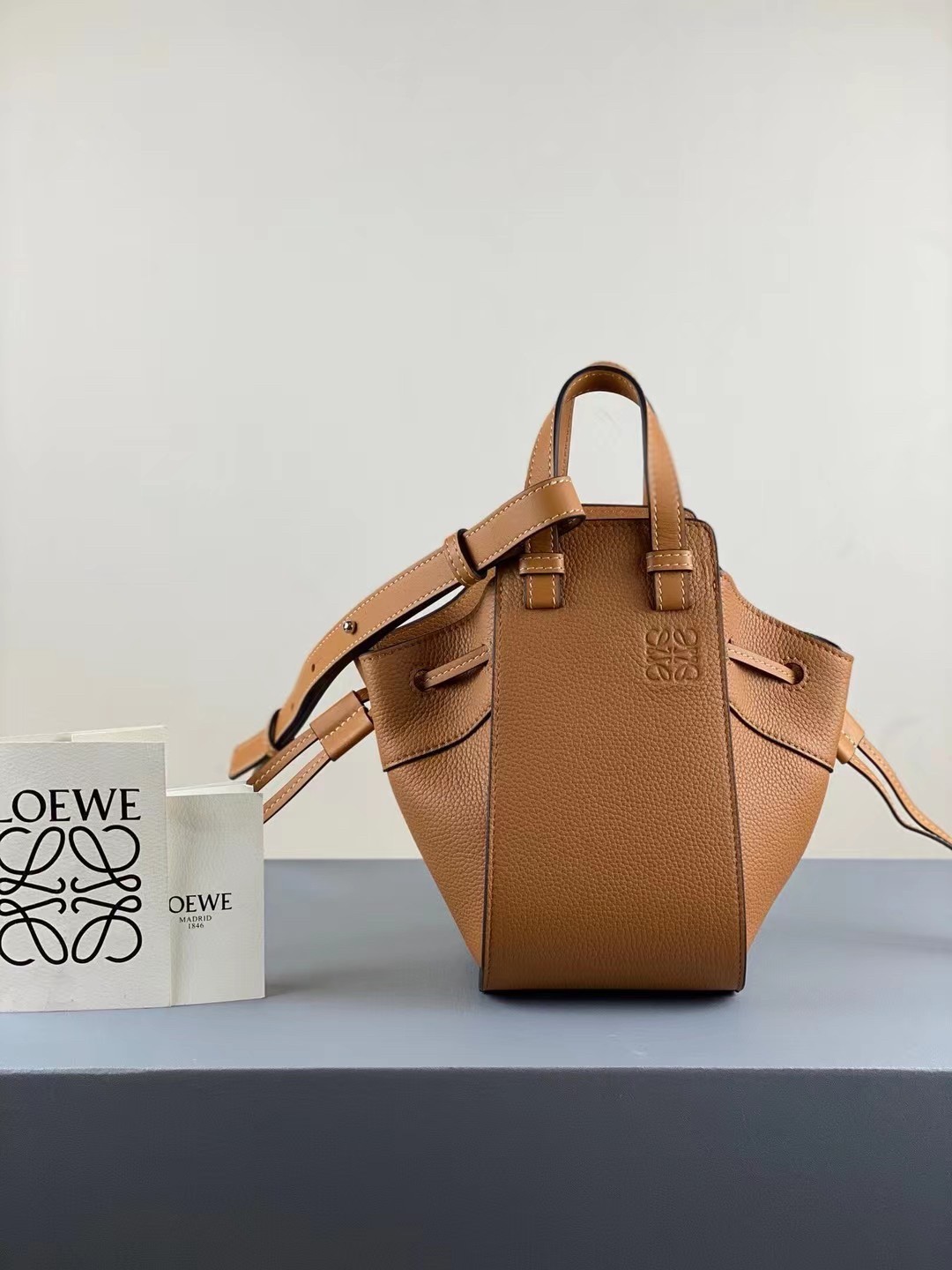 L0ew* mini hammock drawstring bag in brown leather