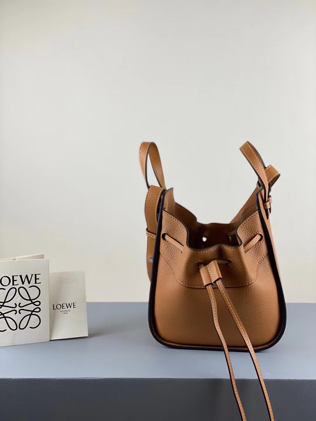 L0ew* mini hammock drawstring bag in brown leather