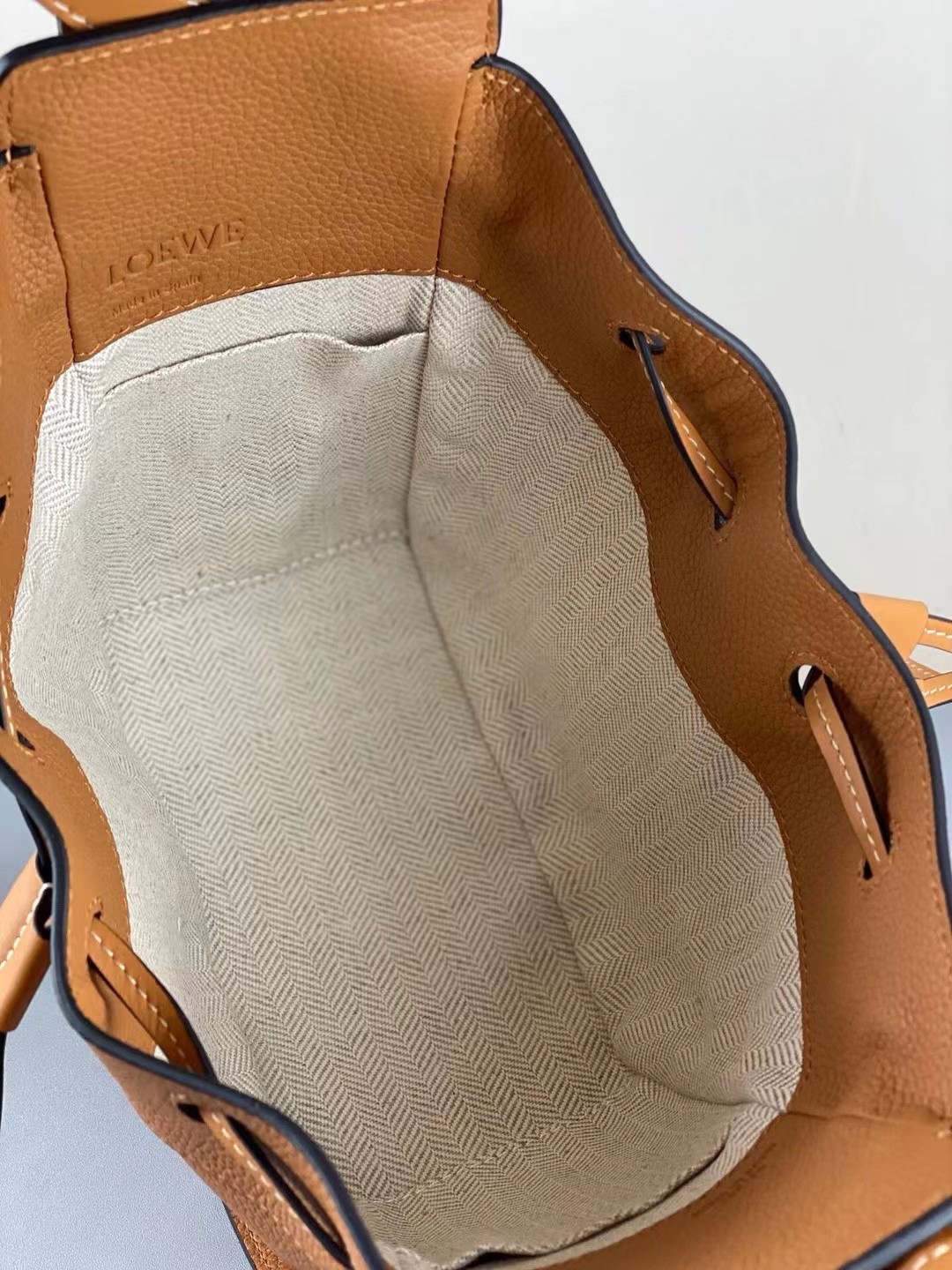 L0ew* mini hammock drawstring bag in brown leather