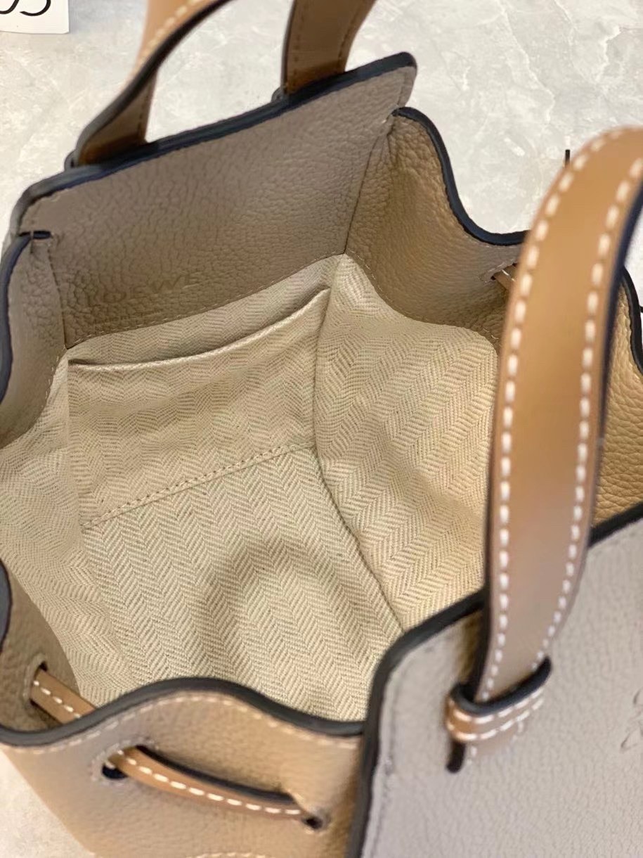 L0ew* mini hammock drawstring bag in sand leather