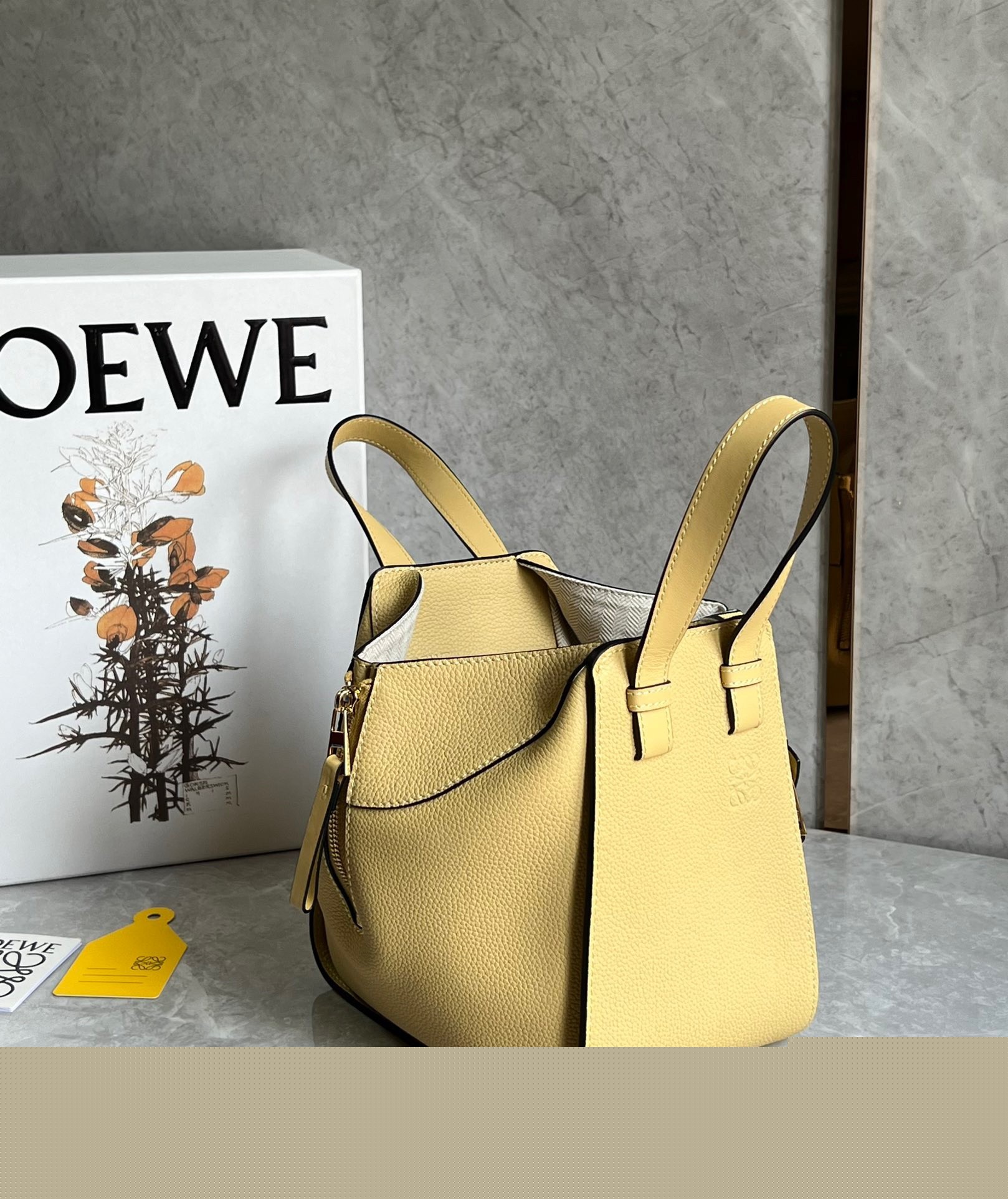 L0ew* compact hammock bag in dark butter grained calfskin