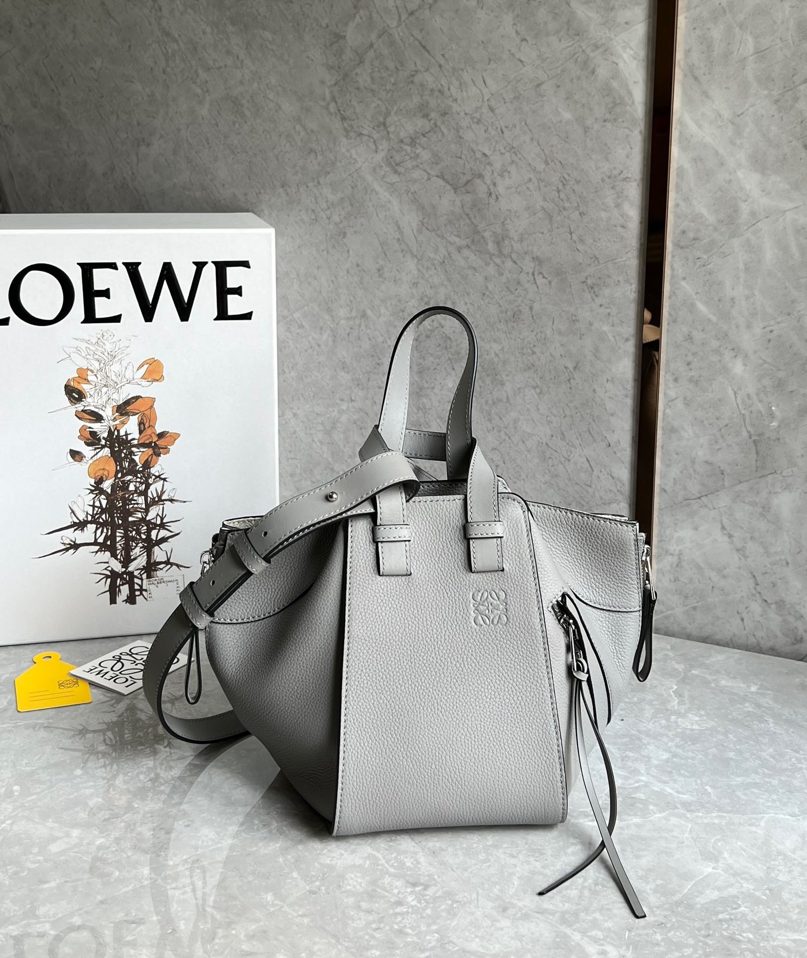L0ew* compact hammock bag in pearl grey grained calfskin