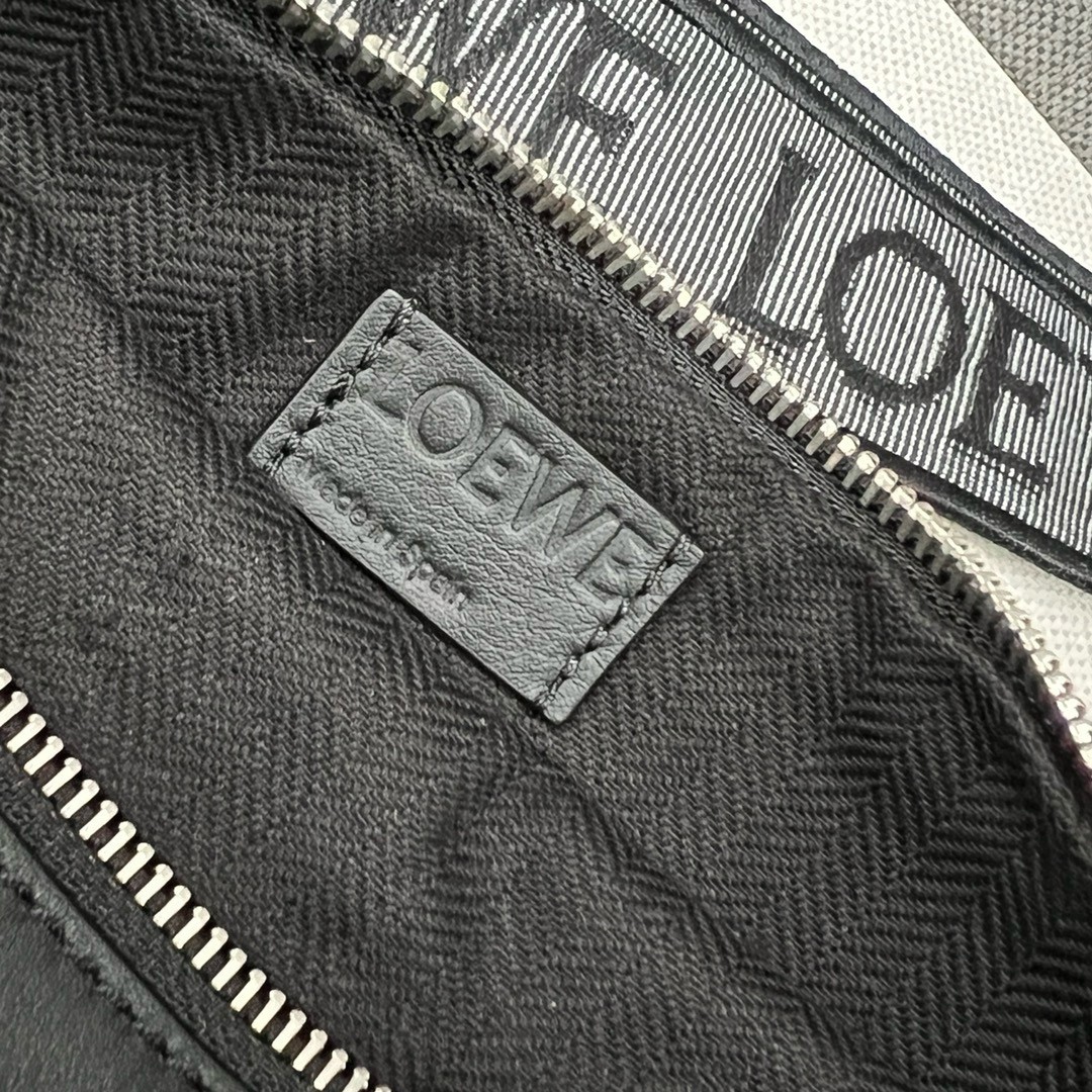 L0ew* anton sling bag in black calfskin and jacquard