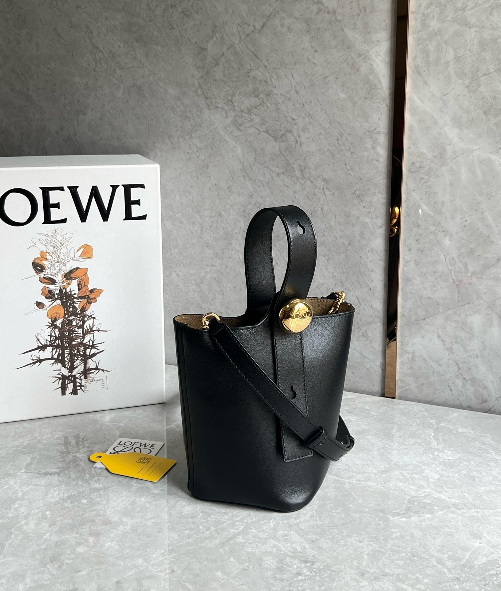 L0ew* mini pebble bucket bag in black calfskin