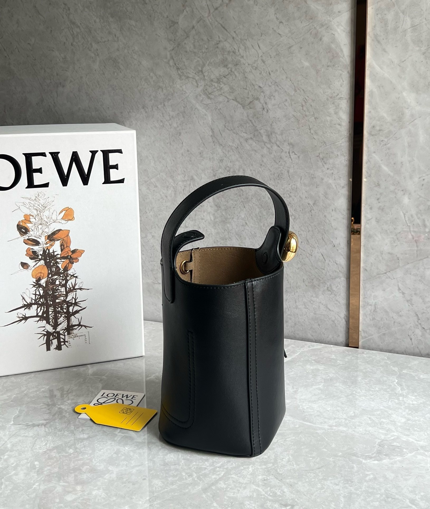L0ew* mini pebble bucket bag in black calfskin