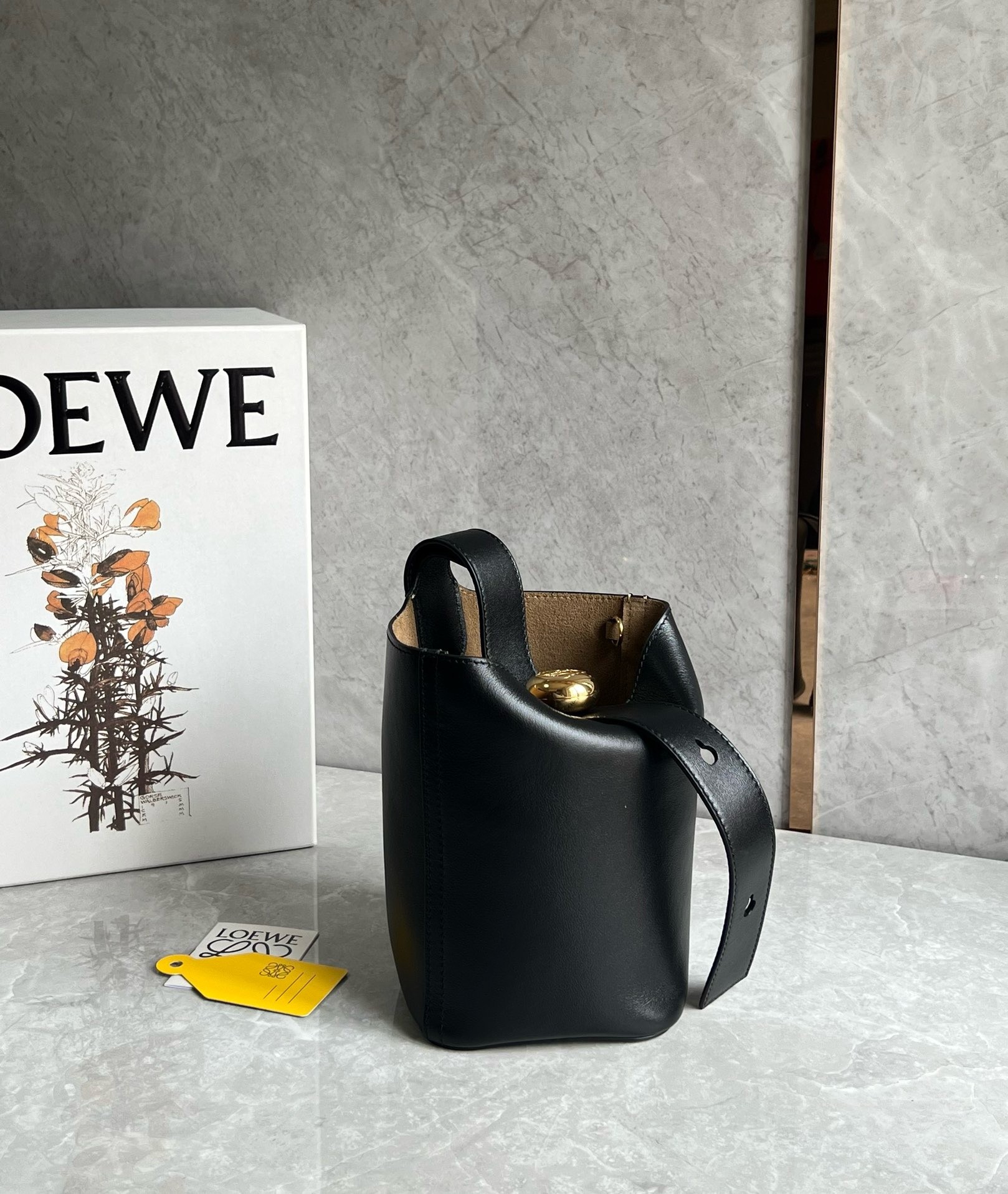 L0ew* mini pebble bucket bag in black calfskin