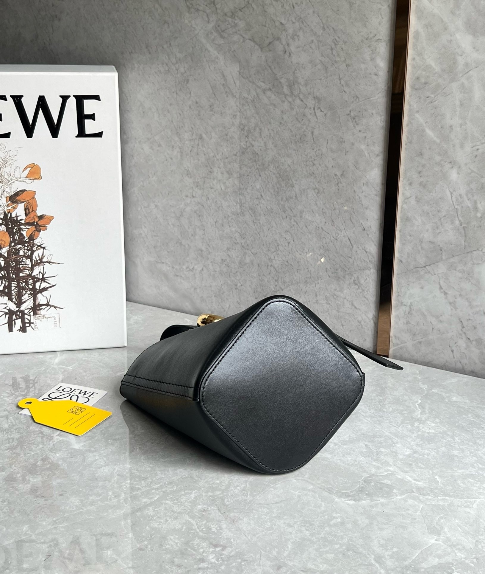 L0ew* mini pebble bucket bag in black calfskin