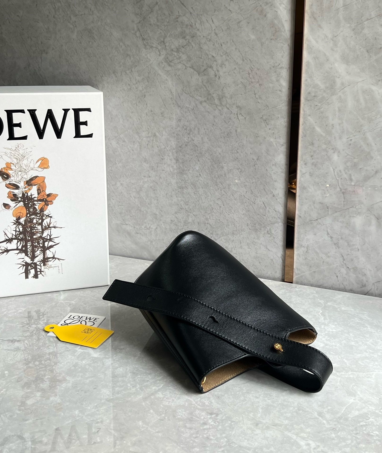 L0ew* mini pebble bucket bag in black calfskin