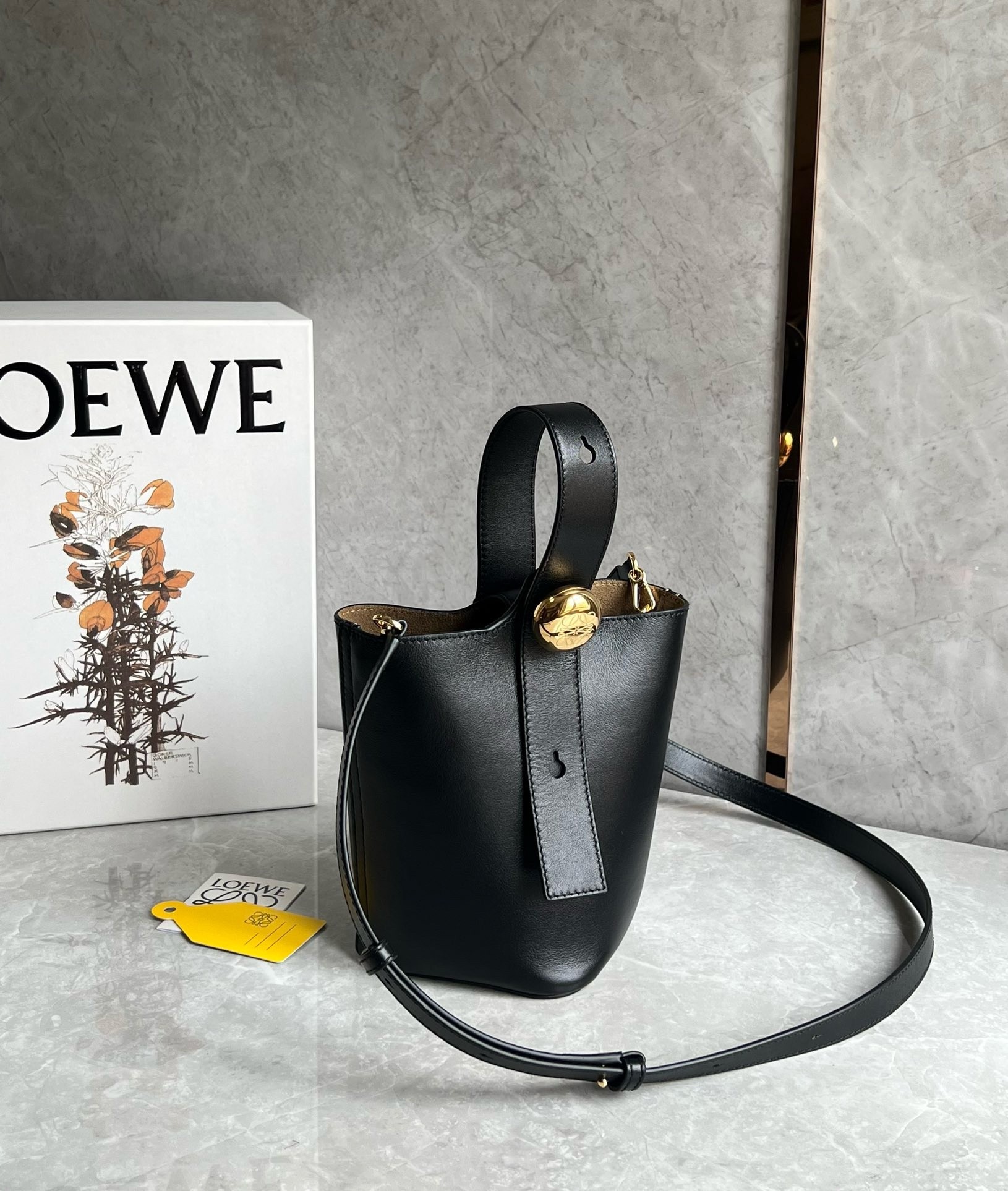 L0ew* mini pebble bucket bag in black calfskin