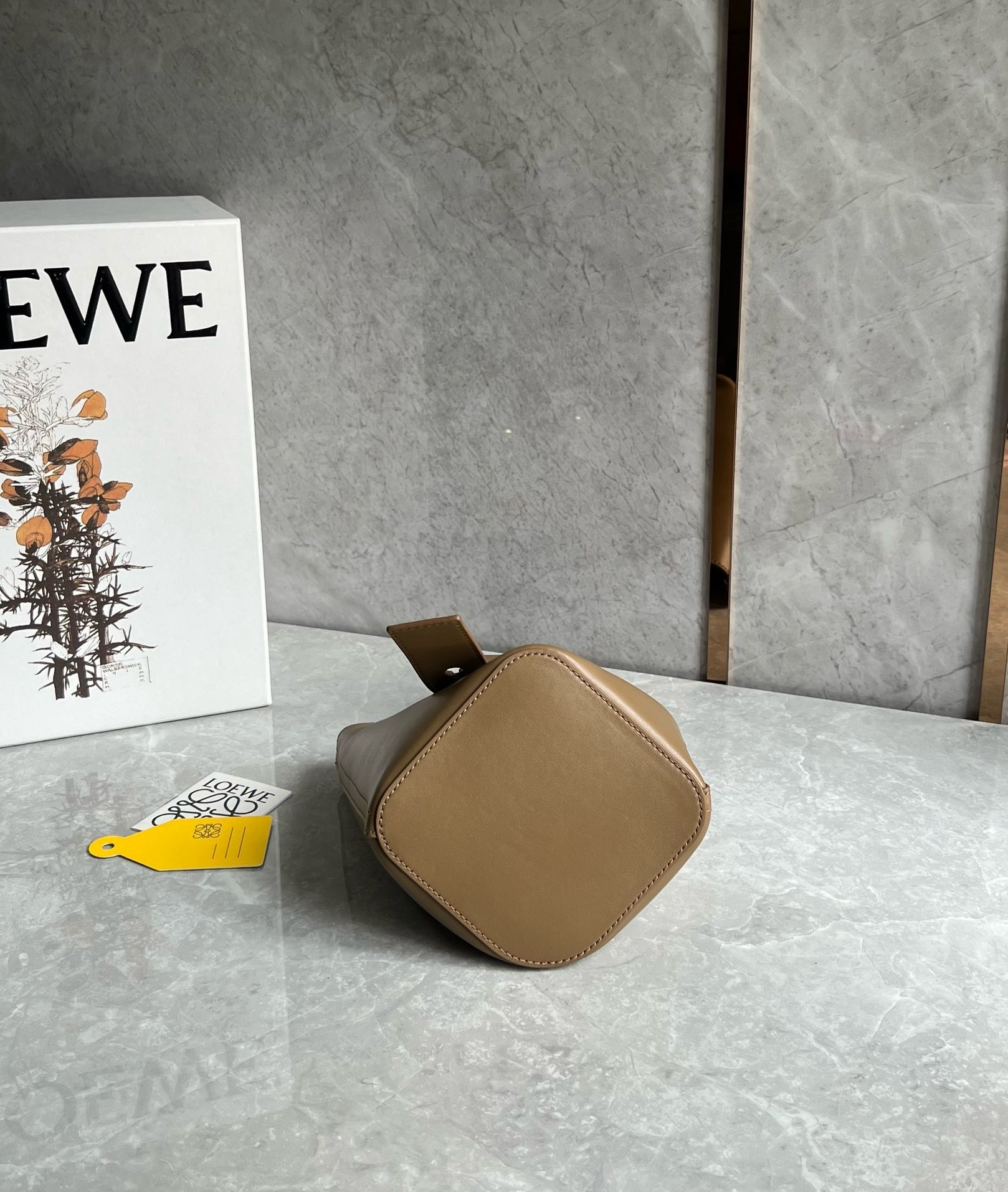 L0ew* mini pebble bucket bag in oak calfskin