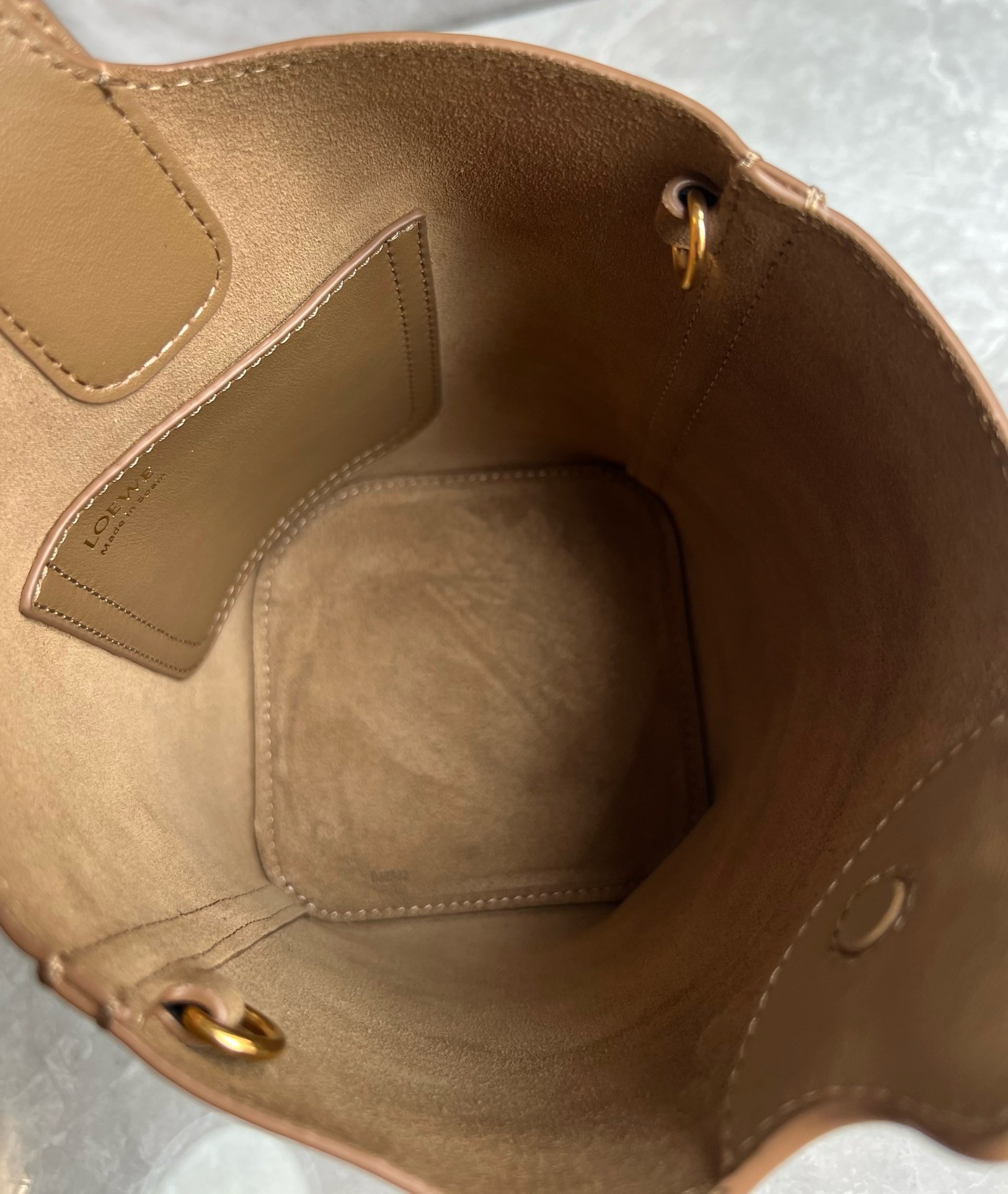 L0ew* mini pebble bucket bag in oak calfskin