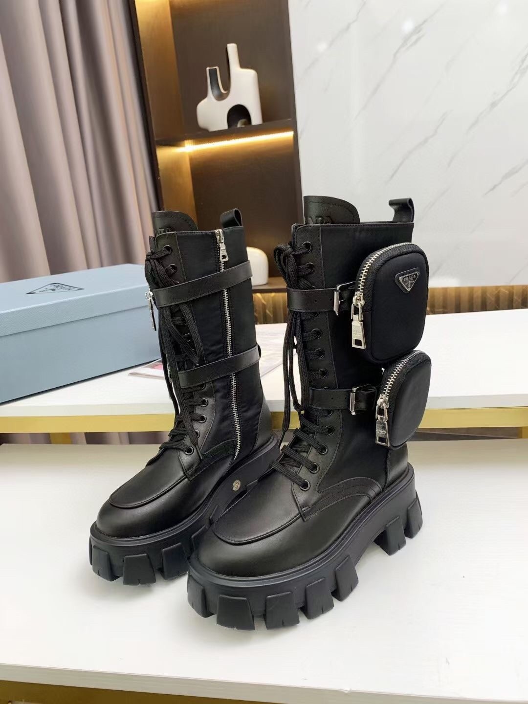 Pra*a monolith boots in noir leather and nylon fabric