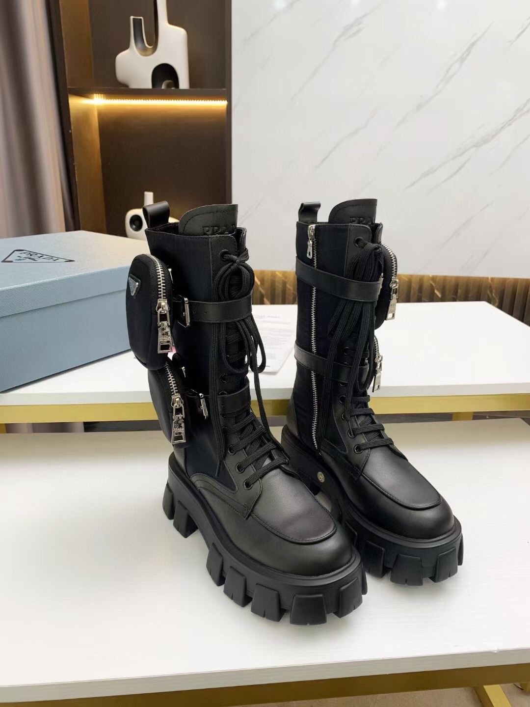 Pra*a monolith boots in noir leather and nylon fabric