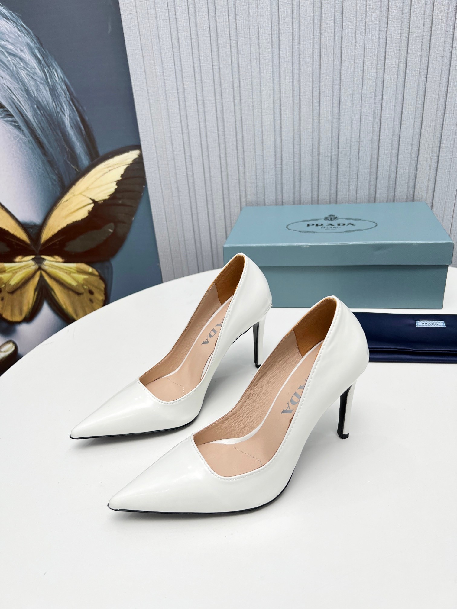 Pra*a pumps 95mm in white patent leather