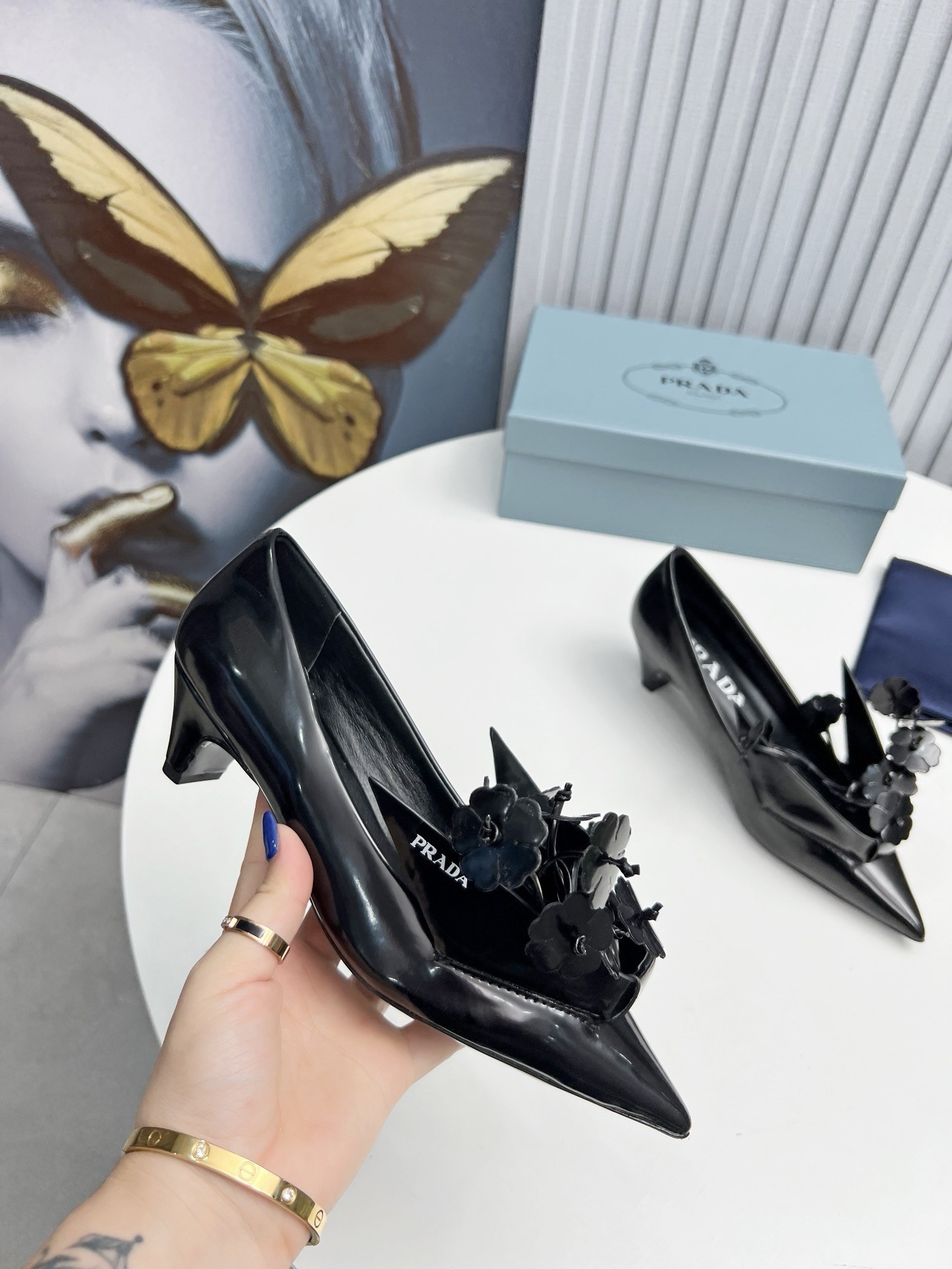 Pra*a pumps 45mm in black leather with floral appliques
