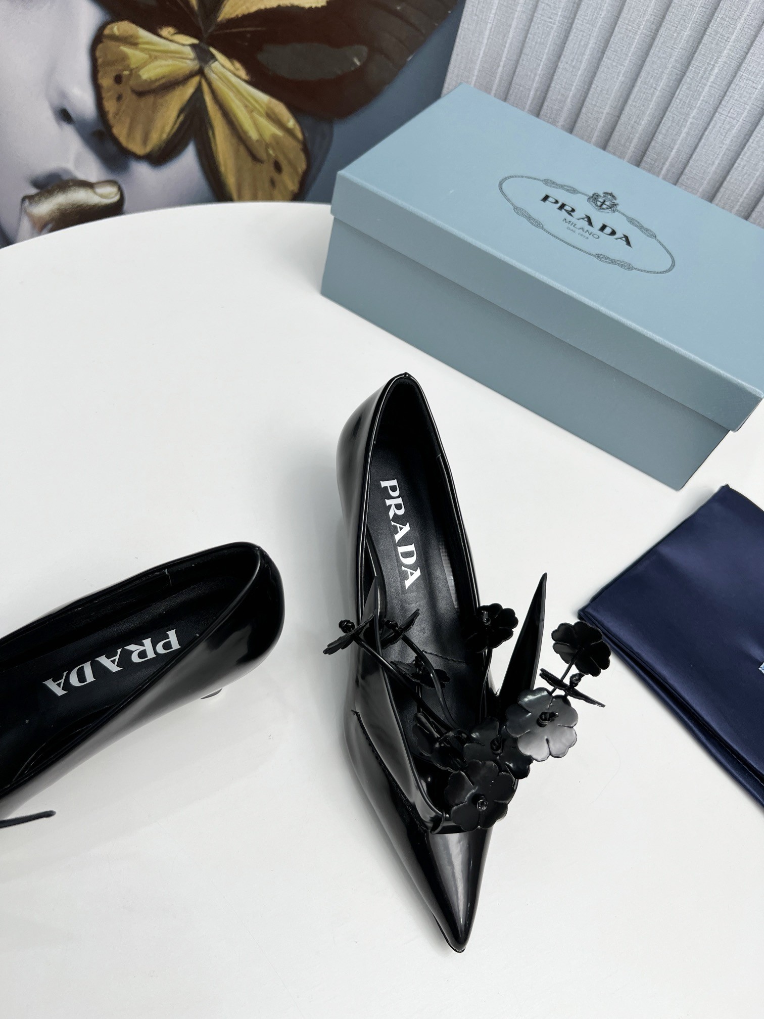 Pra*a pumps 45mm in black leather with floral appliques