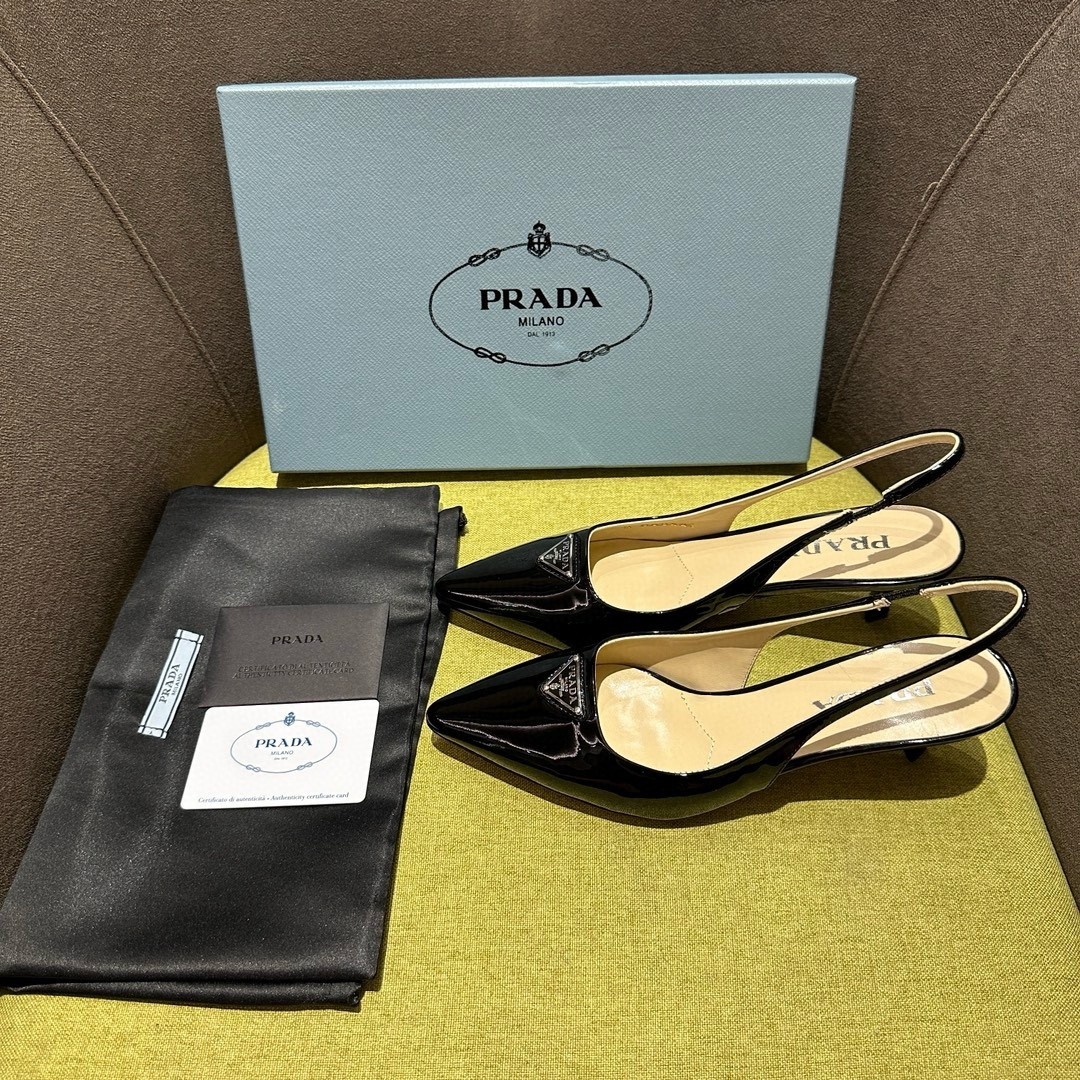 Pra*a slingback pumps 55mm in black patent leather