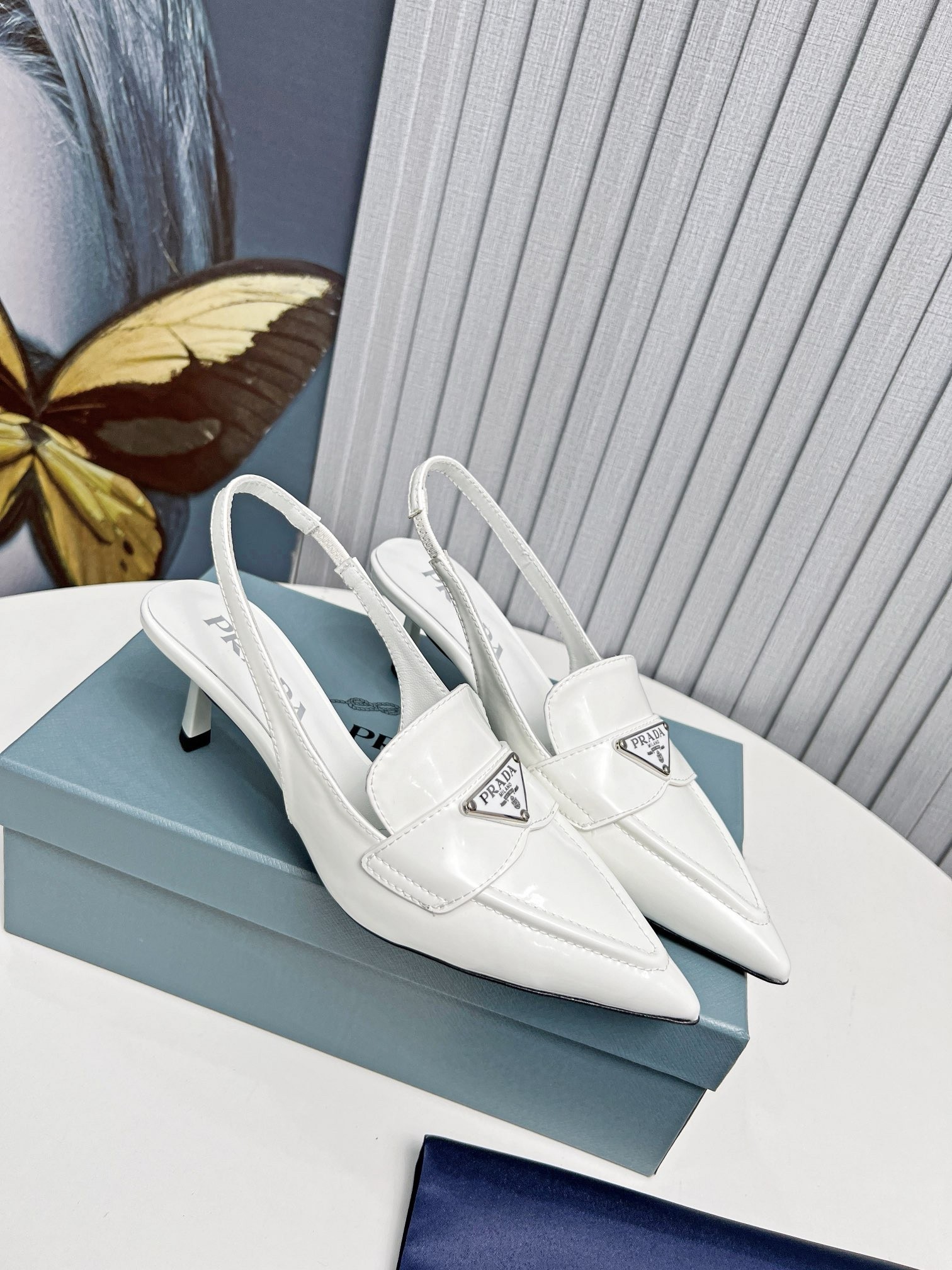 Pra*a slingback pumps 45mm in white patent calfskin